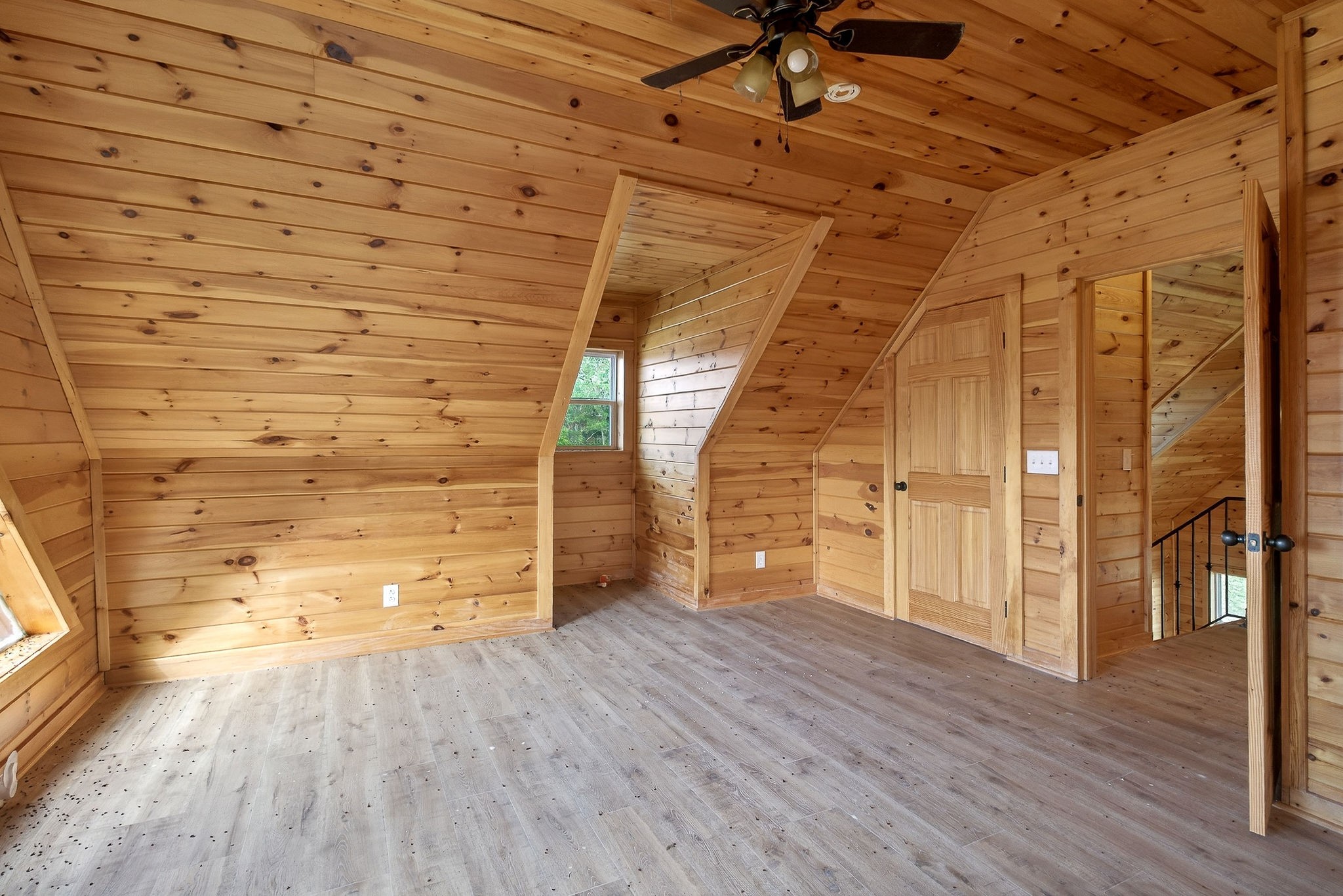 6425 Plateau Road Crossville, TN 38571 - Photo 20 of 42 a view of an empty room with wooden floor and a window