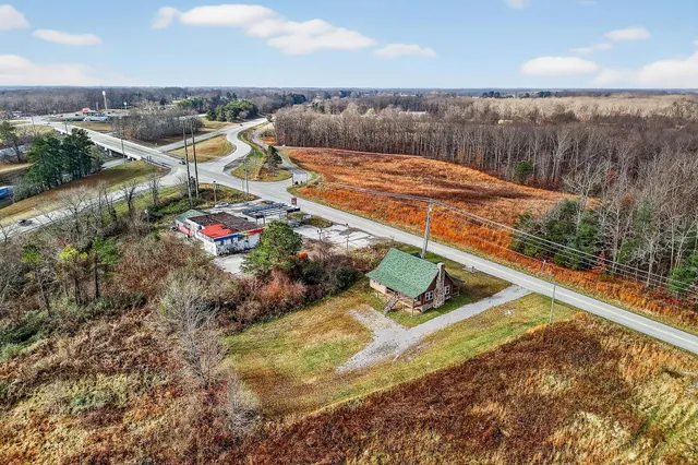 a view of a small pool with chairs