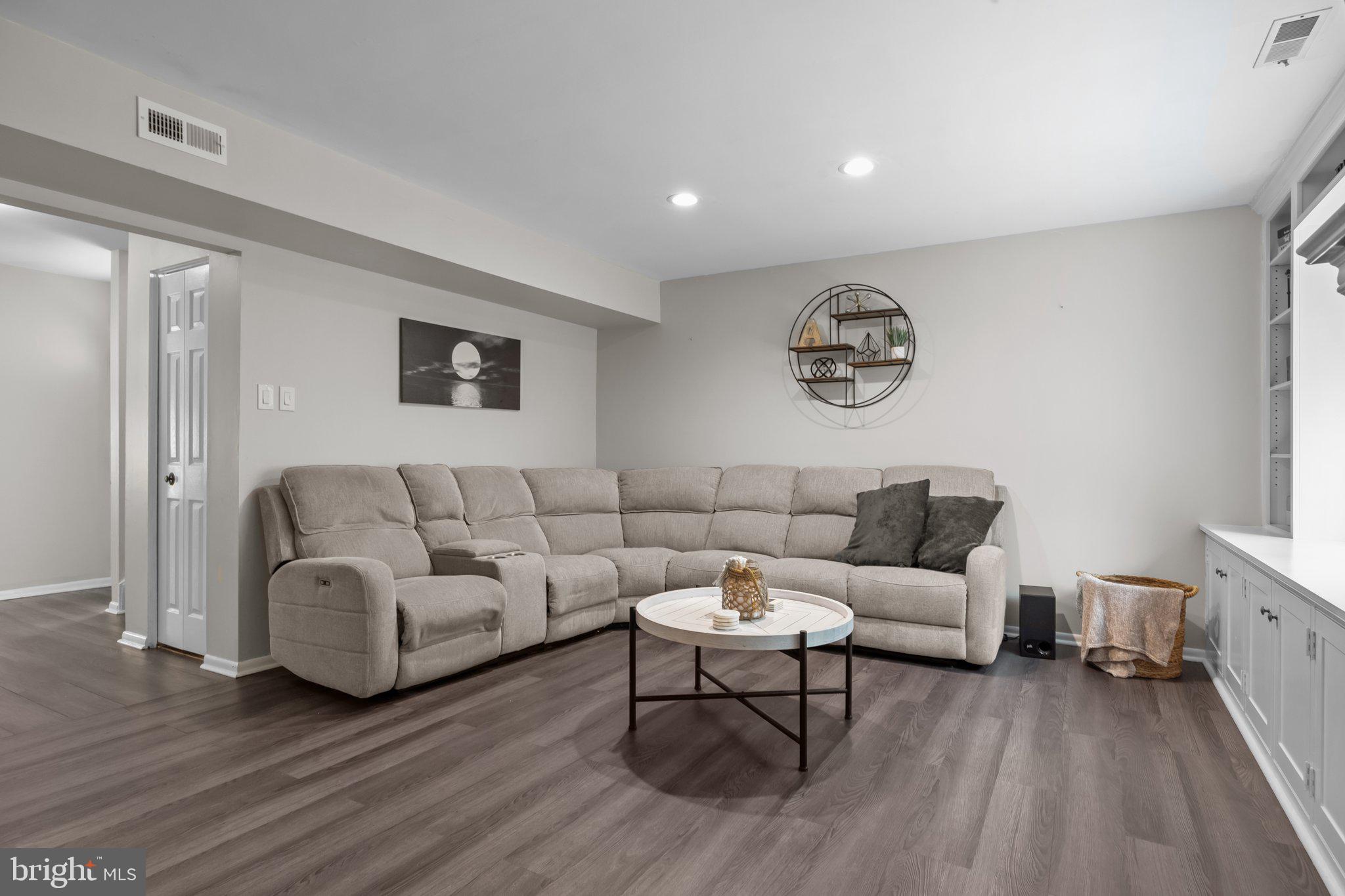 609 Hampton Court Doylestown, PA 18901 - Photo 11 of 41 a living room with furniture and a wooden floor