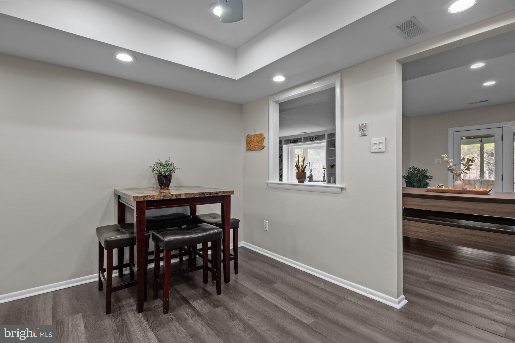 609 Hampton Court Doylestown, PA 18901 - Photo 13 of 41 a view of a dining room with furniture and wooden floor
