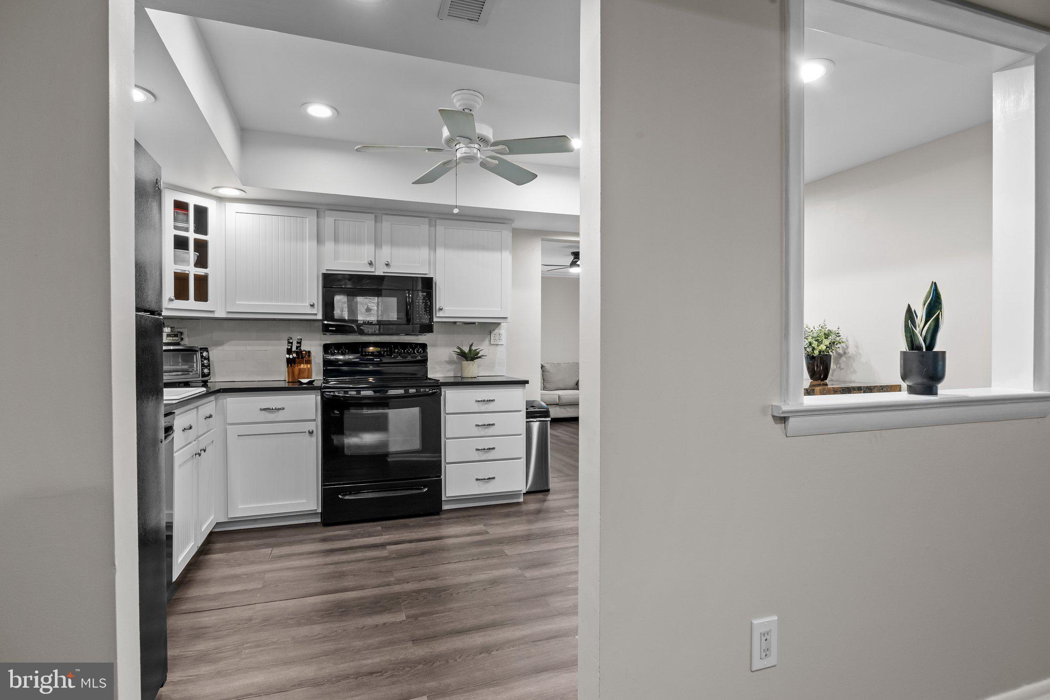 609 Hampton Court Doylestown, PA 18901 - Photo 17 of 41 a kitchen with a refrigerator and a stove top oven