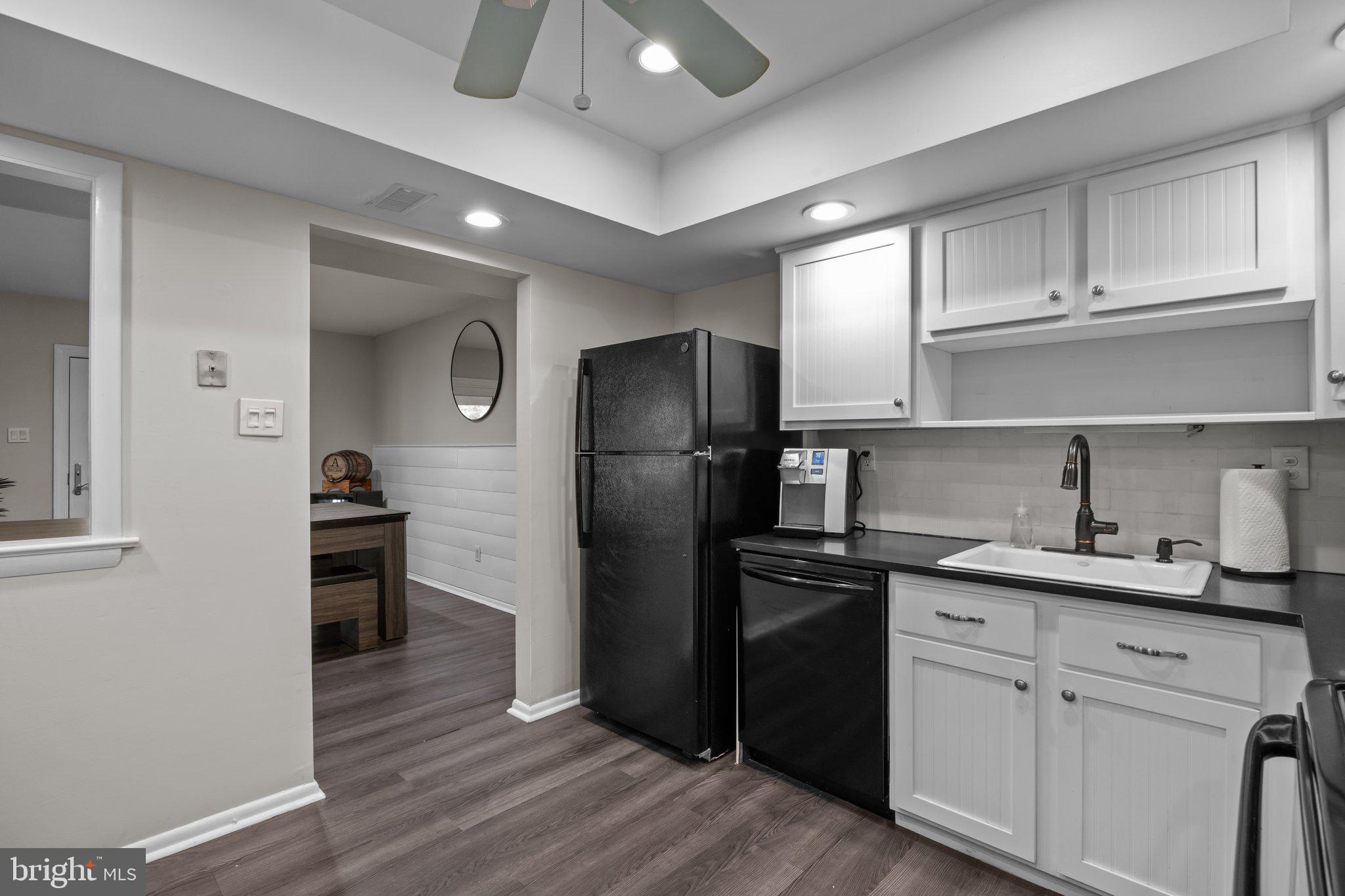 609 Hampton Court Doylestown, PA 18901 - Photo 18 of 41 a kitchen with a refrigerator sink and cabinets