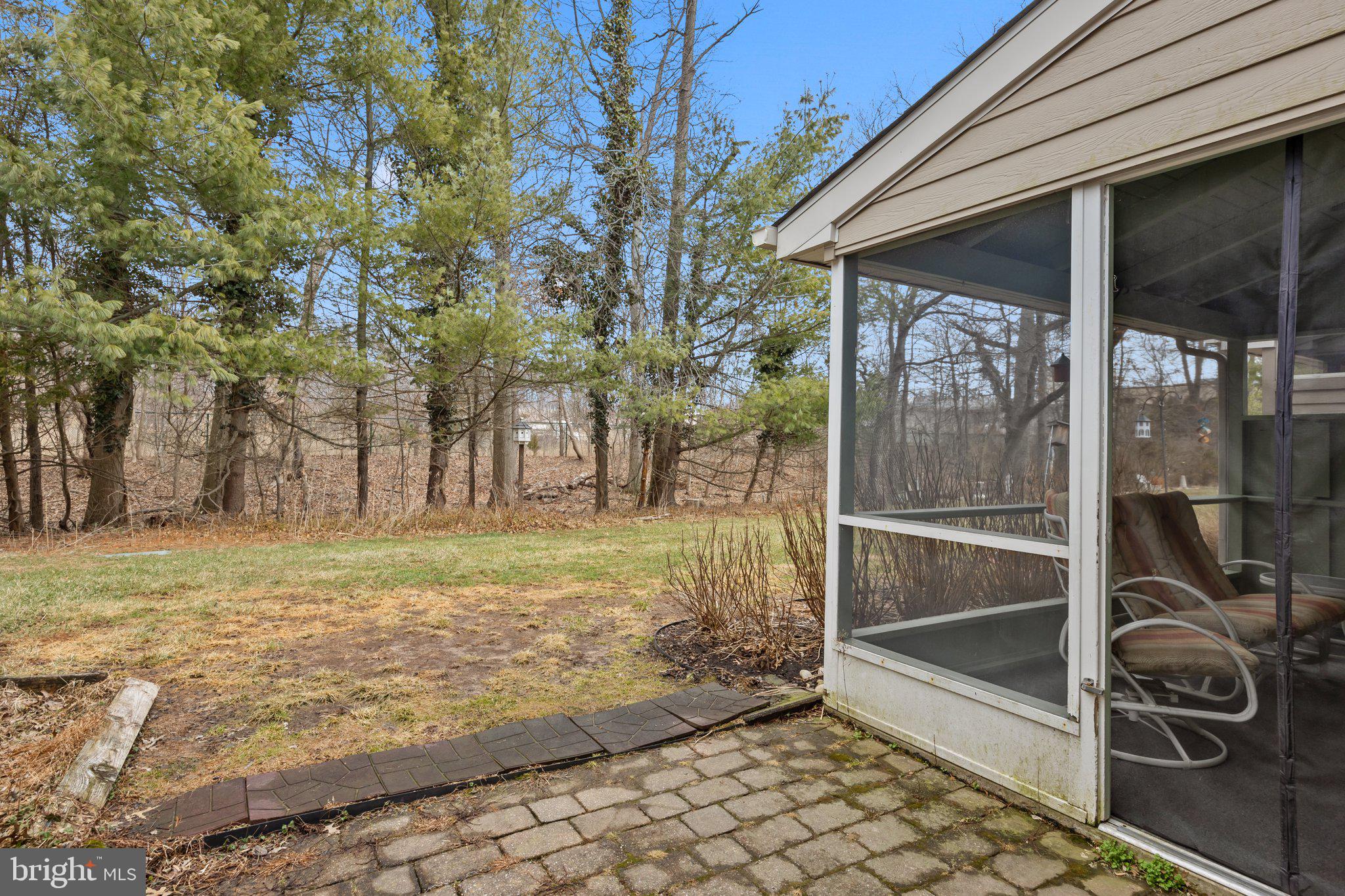 609 Hampton Court Doylestown, PA 18901 - Photo 38 of 41 a view of a wooden door and a yard