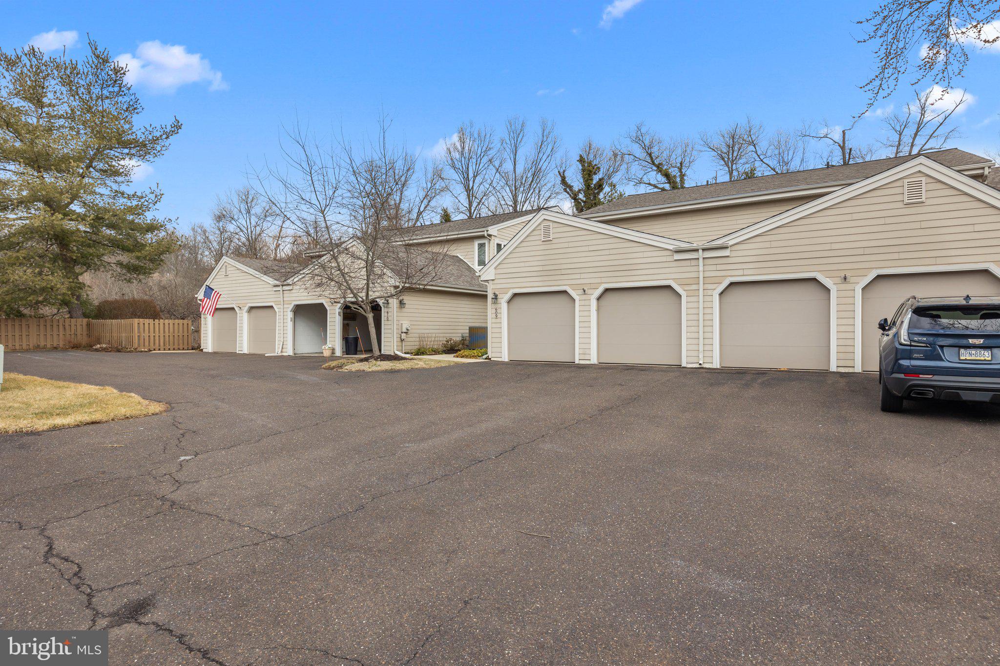 609 Hampton Court Doylestown, PA 18901 - Photo 41 of 41 a view of a white house with a yard and garage