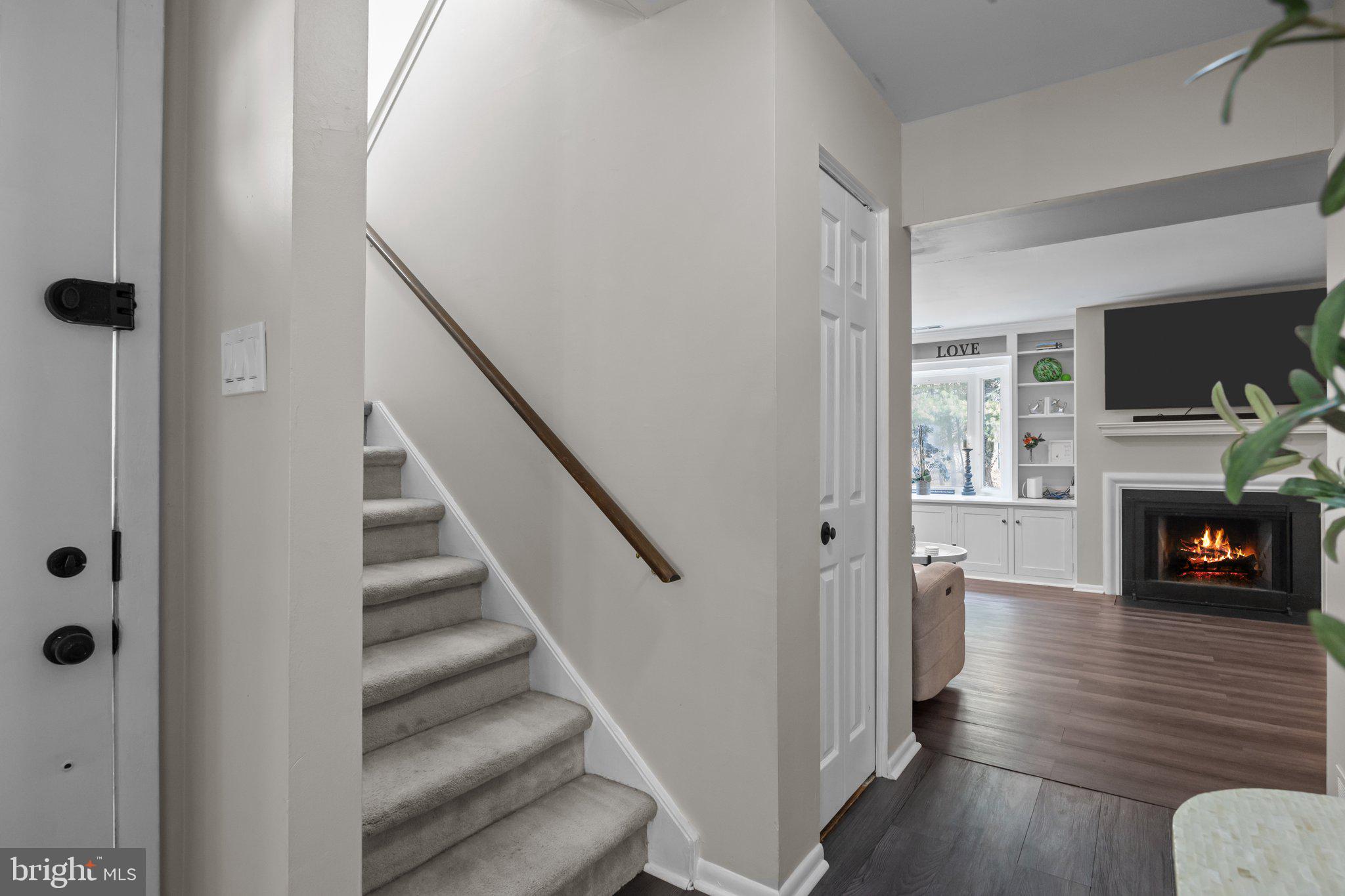 609 Hampton Court Doylestown, PA 18901 - Photo 6 of 41 a view of a livingroom with wooden floor and a fireplace