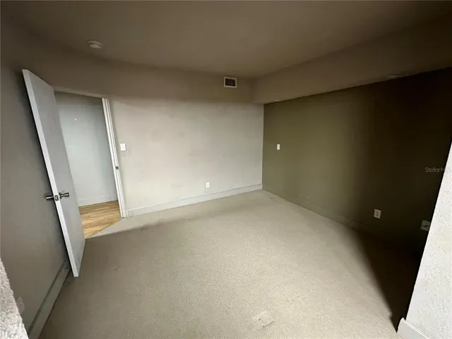 an empty room with a fireplace
