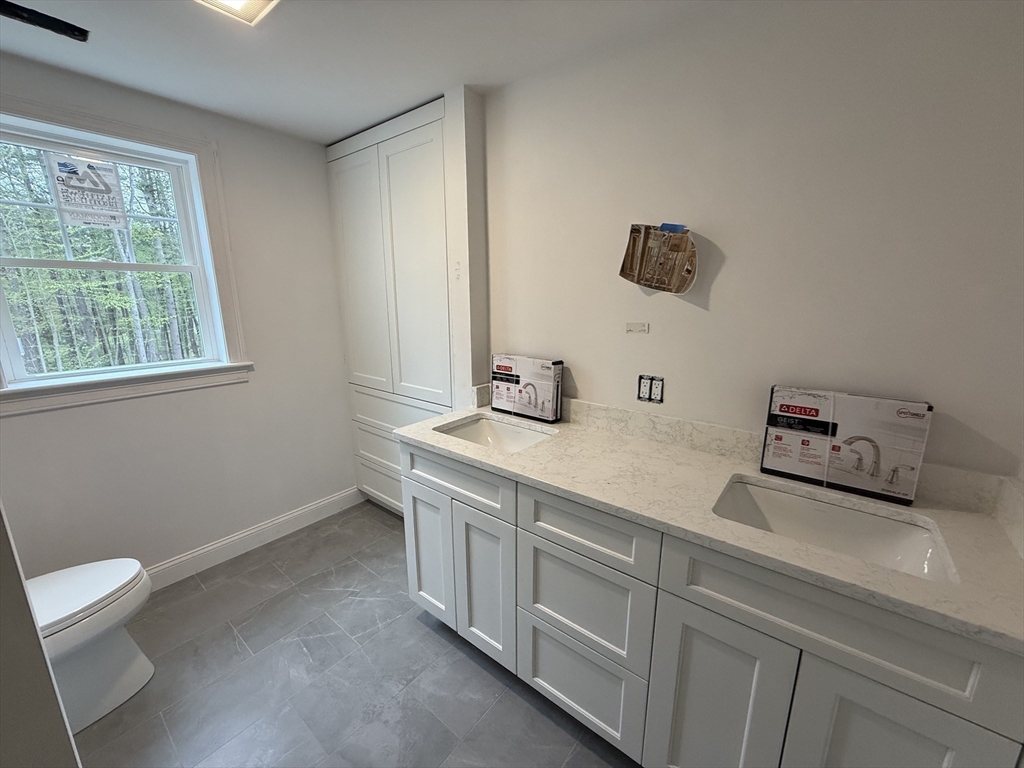 120 Maple Street Stow, MA 01775 - Photo 28 of 36 a bathroom with a sink and a toilet