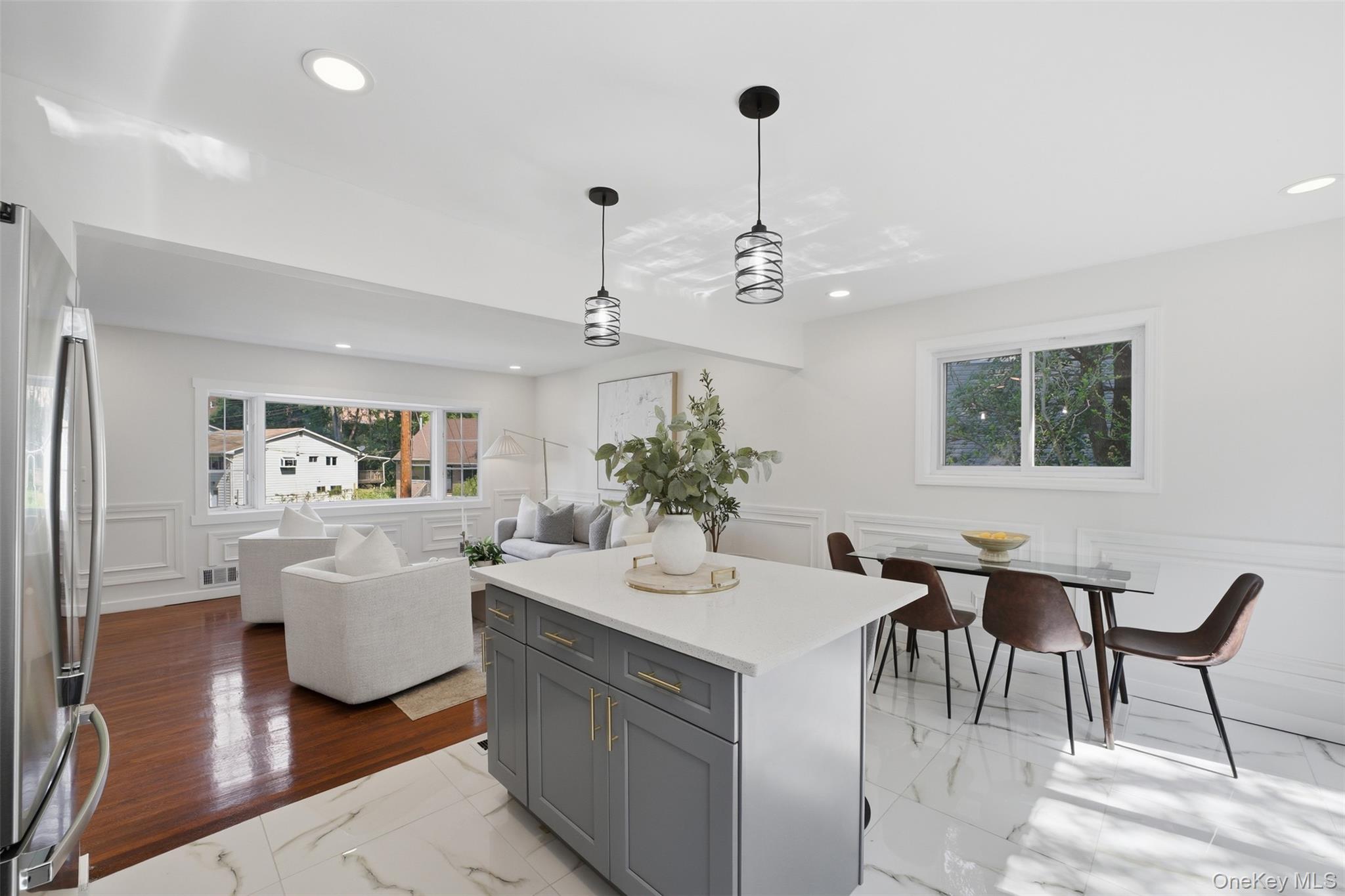24 Fuller Road Ossining, NY 10562 - Photo 12 of 48 a view of a dining room with furniture wooden floor and chandelier
