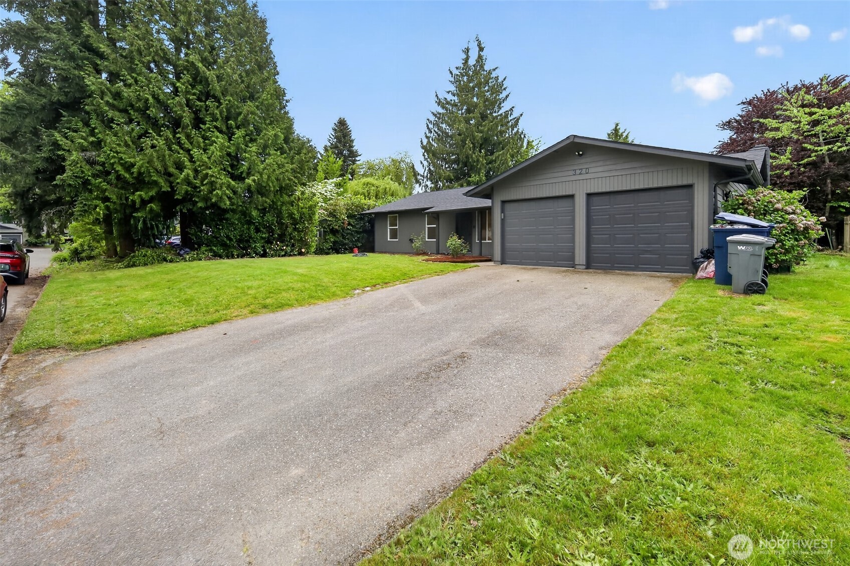 320 213th Place Southwest Bothell, WA 98021 - Photo 26 of 29 a house with green field in front of it