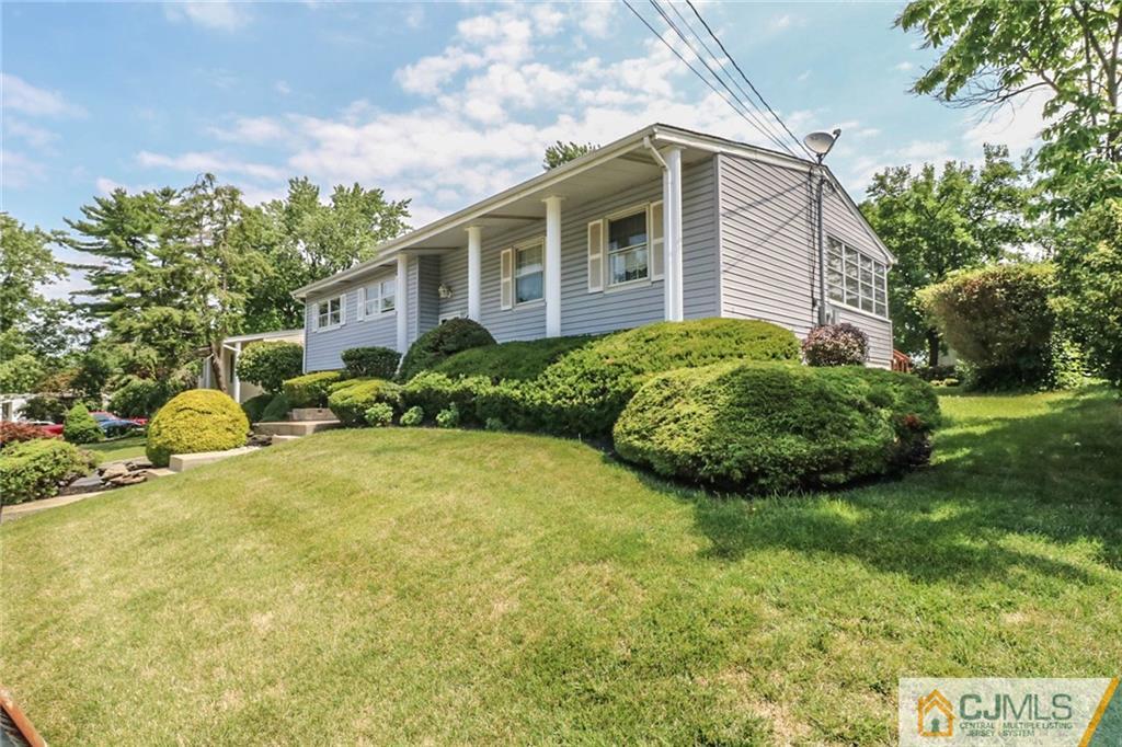 64 Harmon Road Edison, NJ 08837 - Photo 3 of 15 a view of a house with a yard