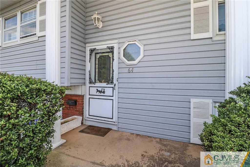 64 Harmon Road Edison, NJ 08837 - Photo 4 of 15 a view of a house with a garage