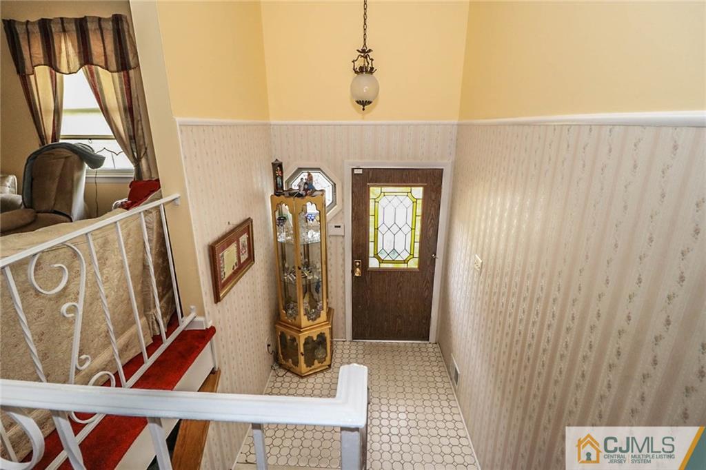 64 Harmon Road Edison, NJ 08837 - Photo 5 of 15 a view of an entryway with wooden floor