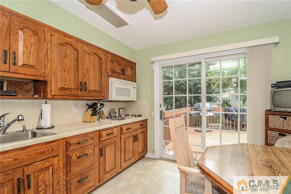 64 Harmon Road Edison, NJ 08837 - Photo 7 of 15 a kitchen with sink cabinets and appliances