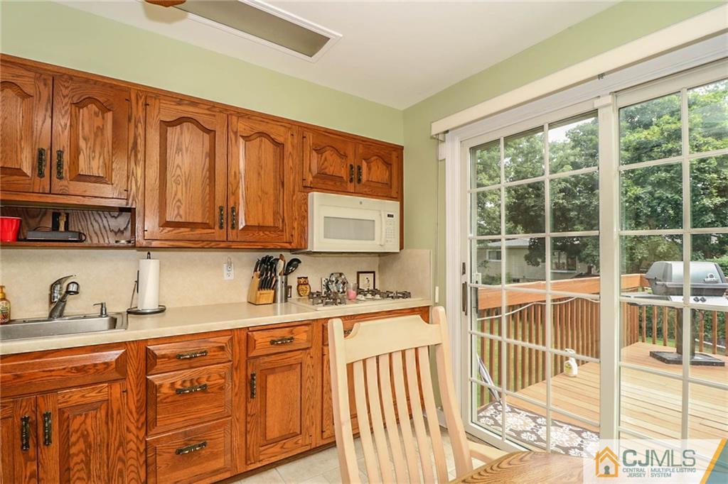 64 Harmon Road Edison, NJ 08837 - Photo 9 of 15 a kitchen with stainless steel appliances granite countertop a stove a sink and dishwasher next to a window