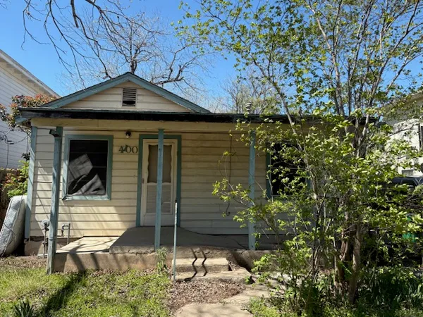 a house with trees in front of it