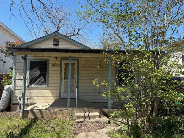 1400 Vargas Road Austin, TX 78741 - Photo 1 of 14 a house with trees in front of it