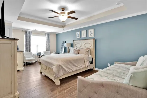 a bed room with a bed and a chandelier