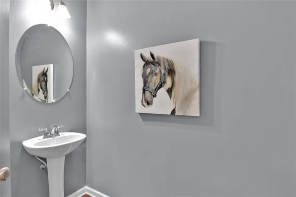 a bathroom with a sink and mirror