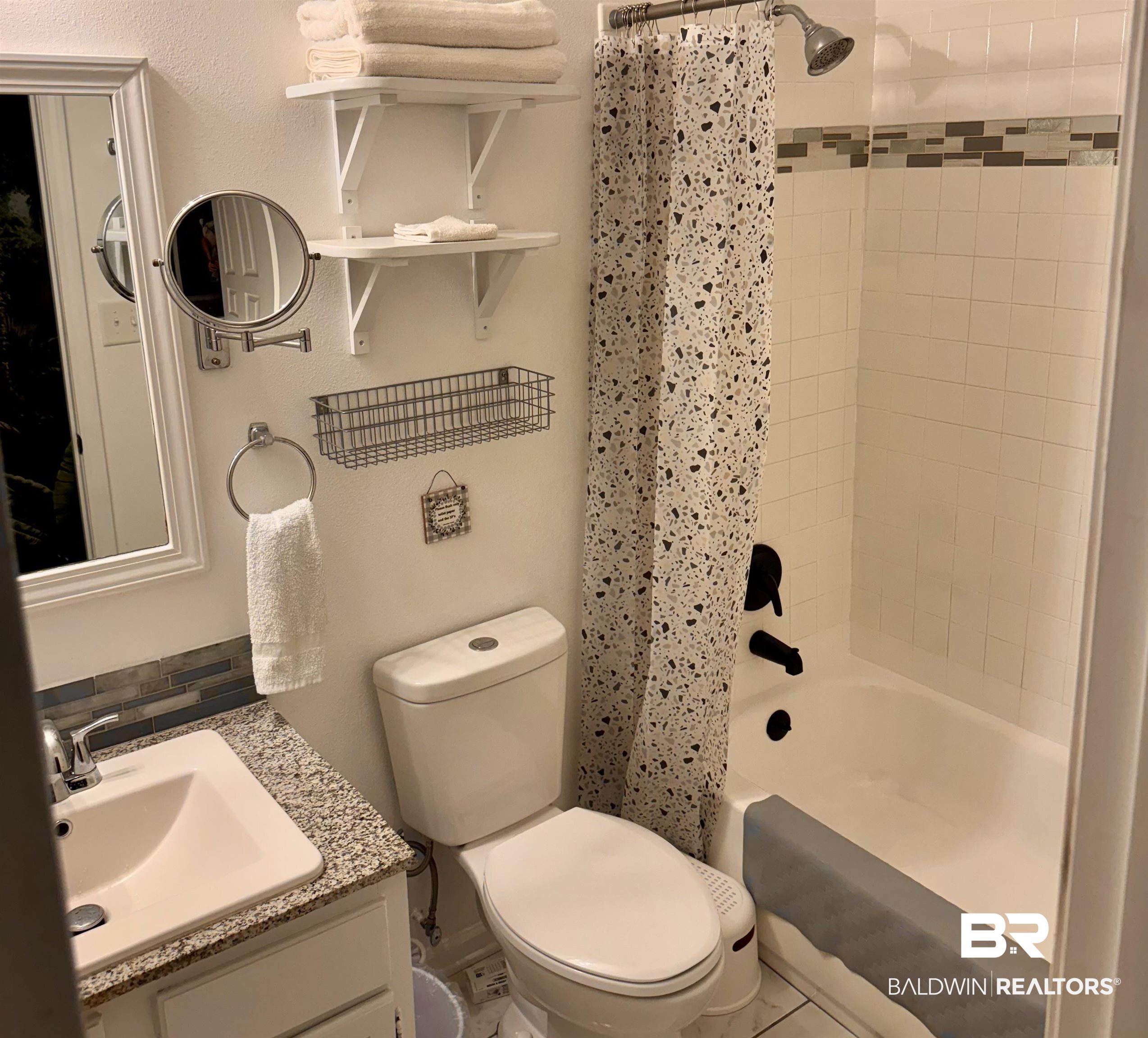 1302 Oak Street Daphne, AL 36526 - Photo 26 of 34 Full bath featuring shower / bath combo with shower curtain and vanity