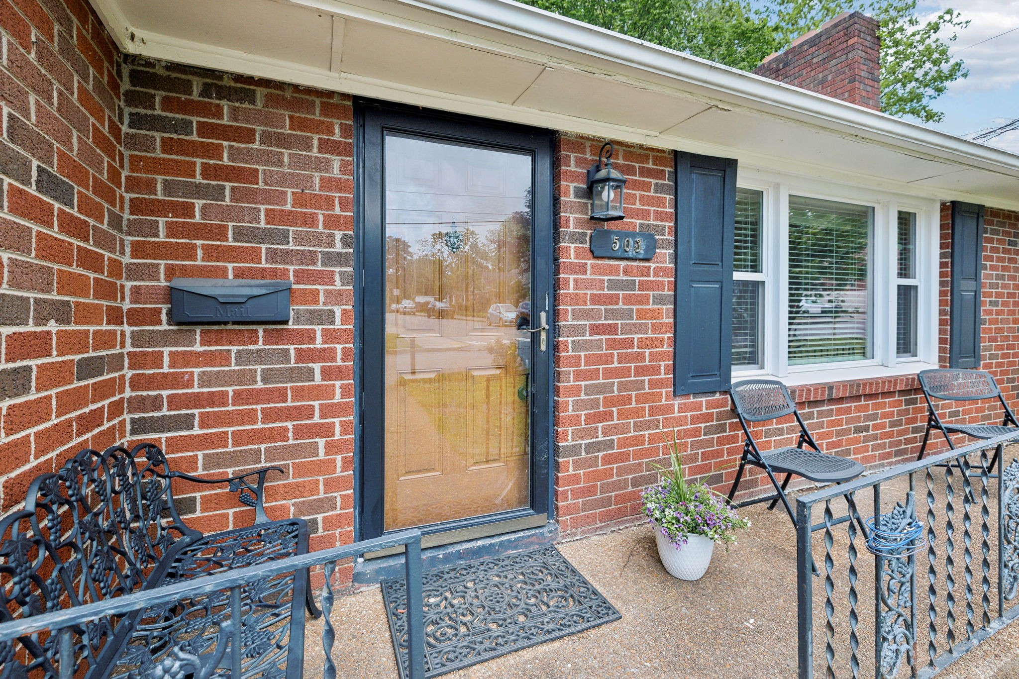 503 West 4th Avenue Springfield, TN 37172 - Photo 2 of 32 a view of a patio with a table and chairs and potted plants