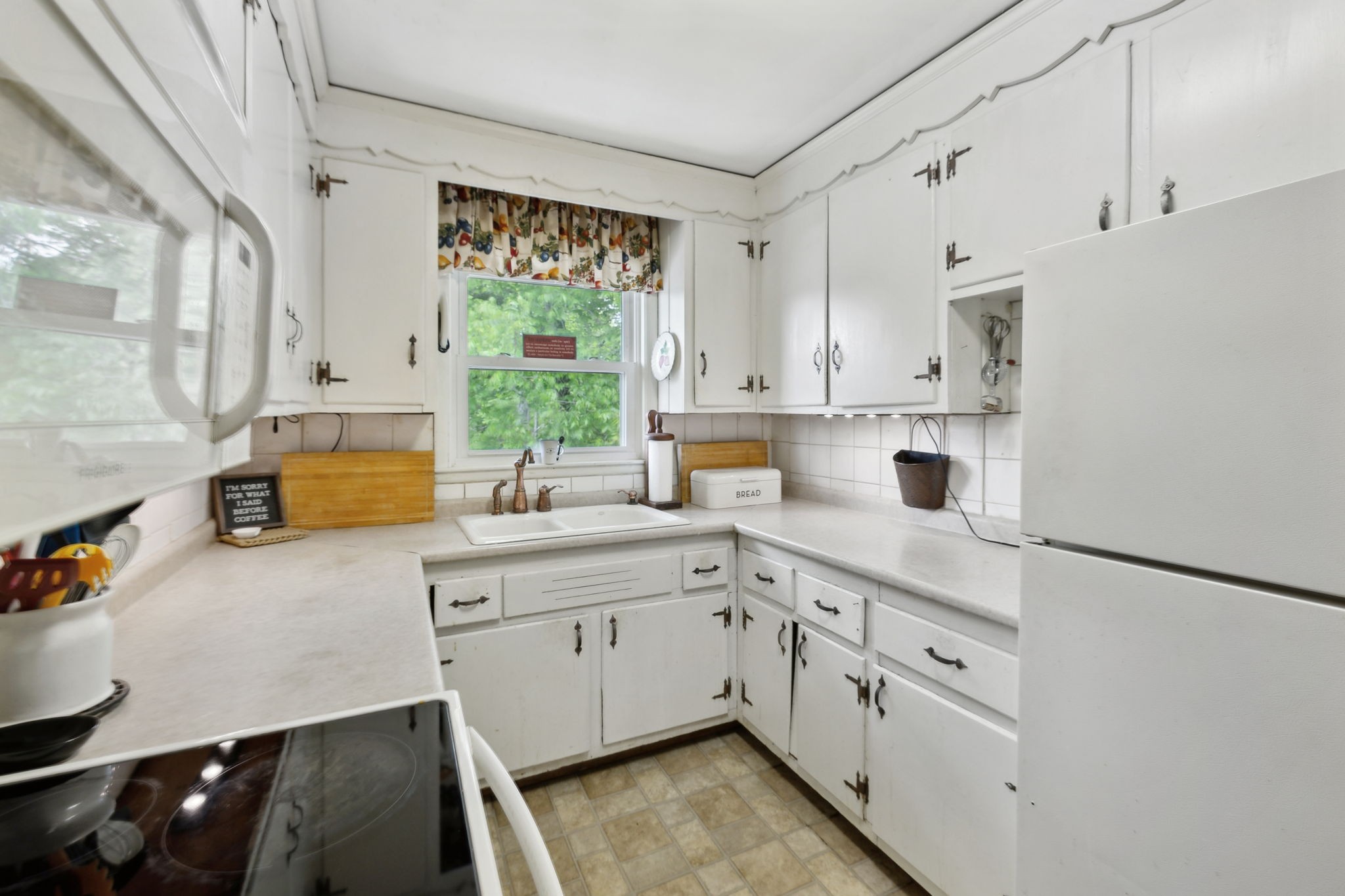 503 West 4th Avenue Springfield, TN 37172 - Photo 7 of 32 a kitchen with a sink cabinets and window
