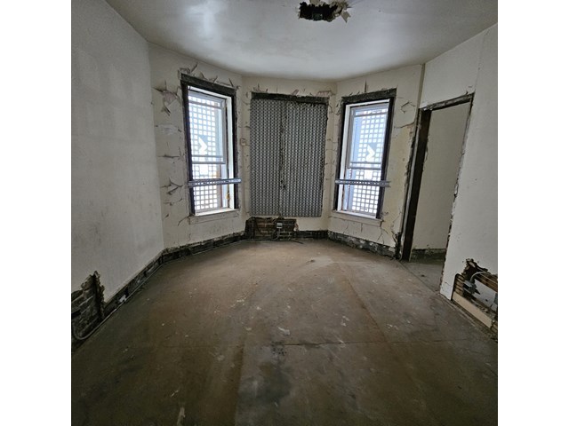 925 South Springfield Avenue Chicago, IL 60624 - Photo 8 of 14 a view of room with window and hardwood