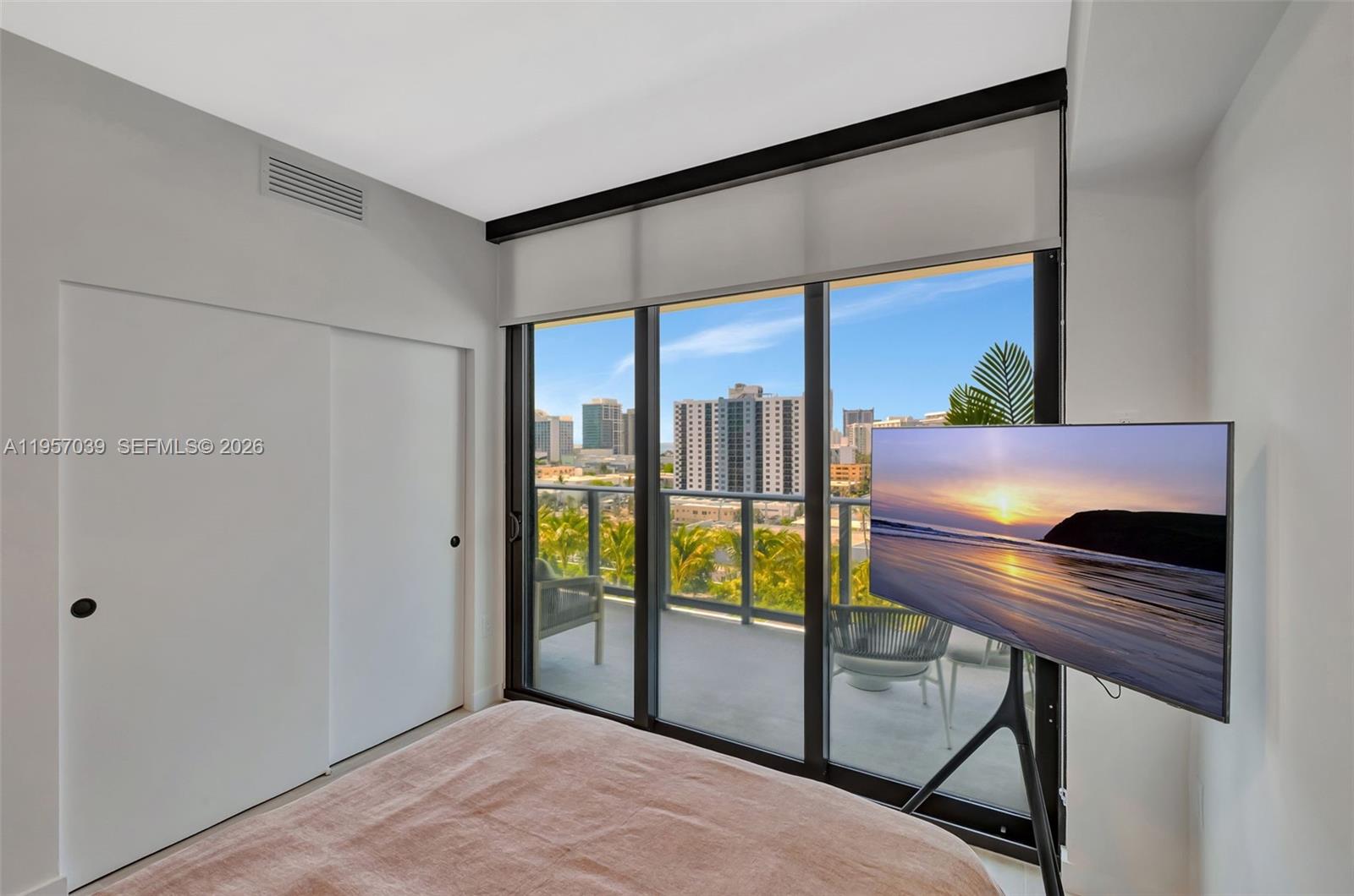 580 72nd Street, Unit 808 Miami Beach, FL 33141 - Photo 14 of 29 a living room with a large window and furniture