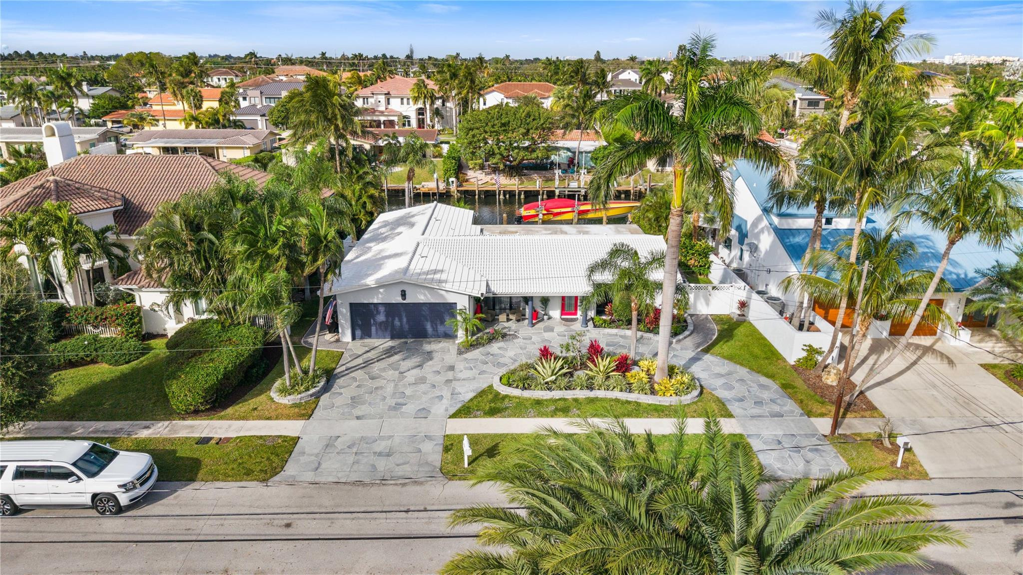 2531 Northeast 47th Street Lighthouse Point, FL 33064 - Photo 1 of 52 a picture of houses with yard