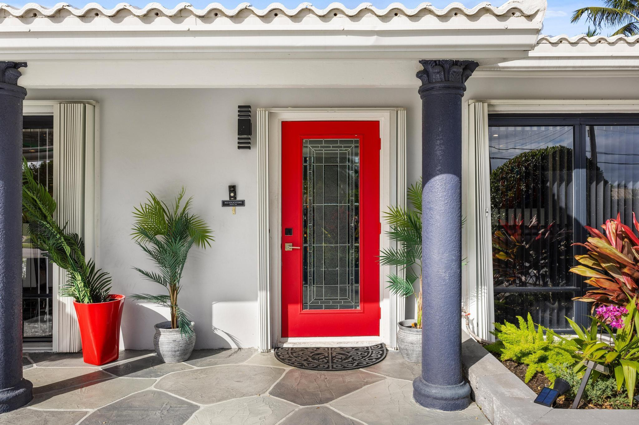 2531 Northeast 47th Street Lighthouse Point, FL 33064 - Photo 15 of 52 a potted plant in front of a door