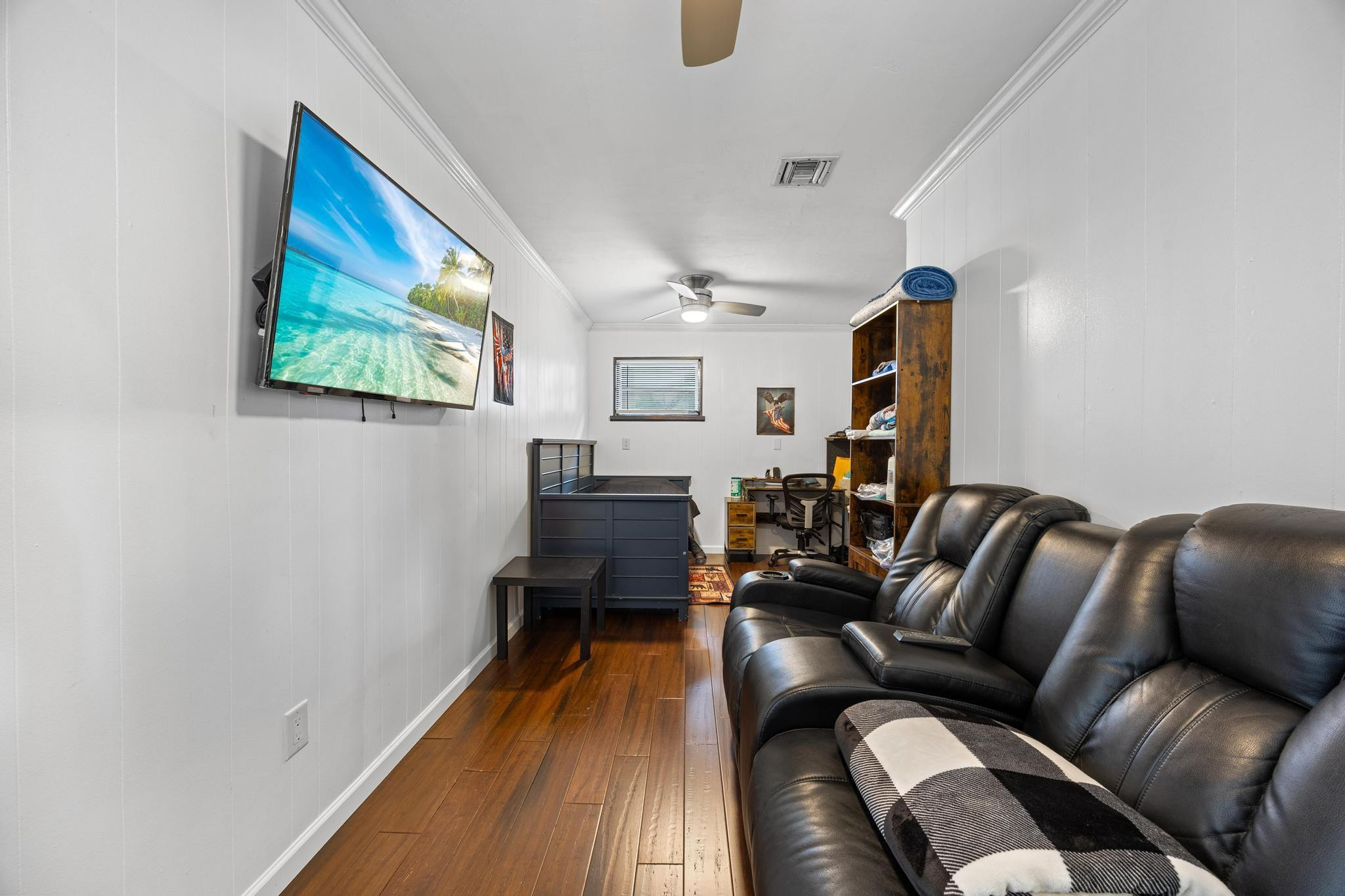 2531 Northeast 47th Street Lighthouse Point, FL 33064 - Photo 17 of 52 a living room with furniture and a wooden floor