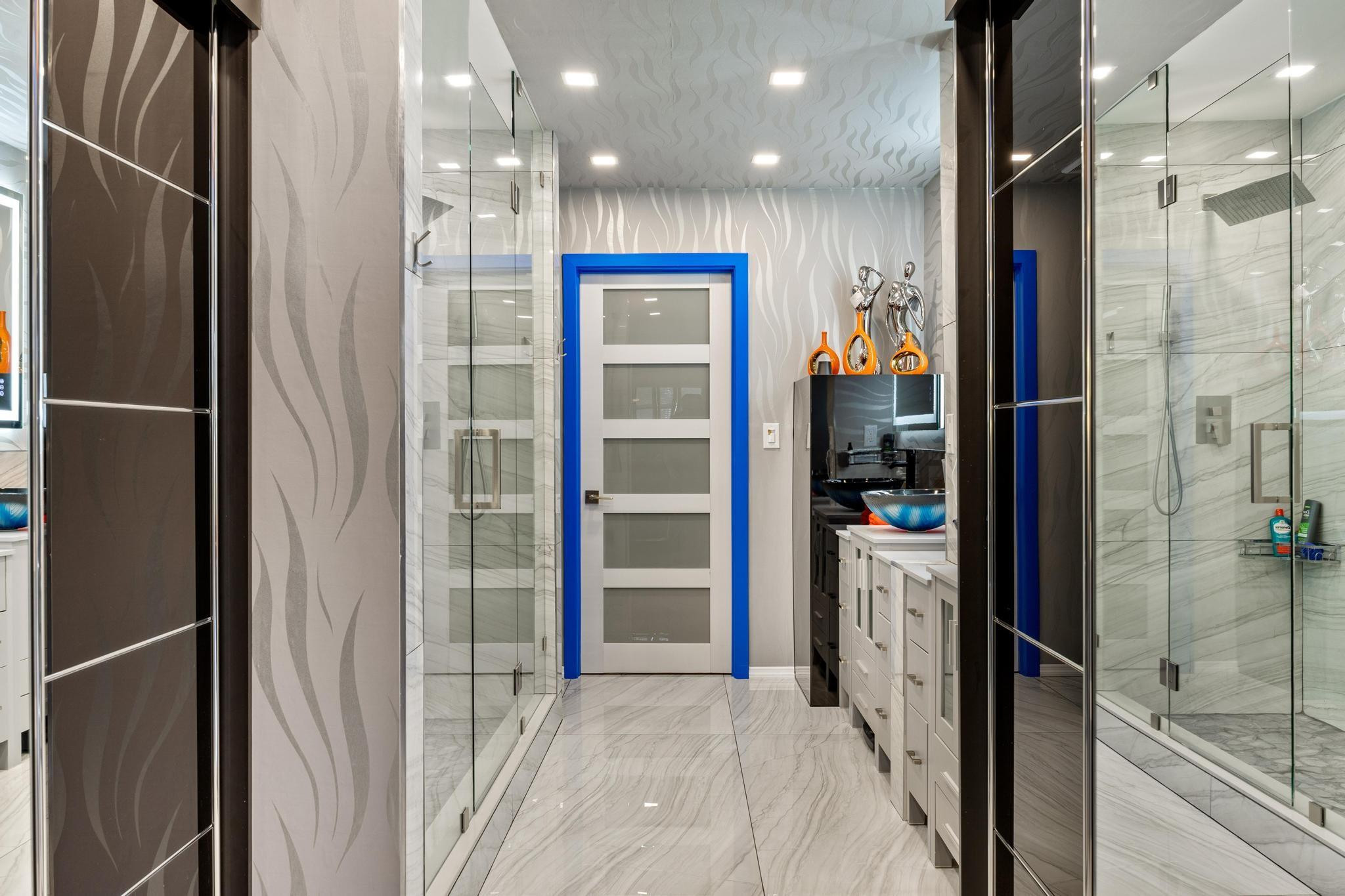 2531 Northeast 47th Street Lighthouse Point, FL 33064 - Photo 22 of 52 a bathroom with a glass shower door