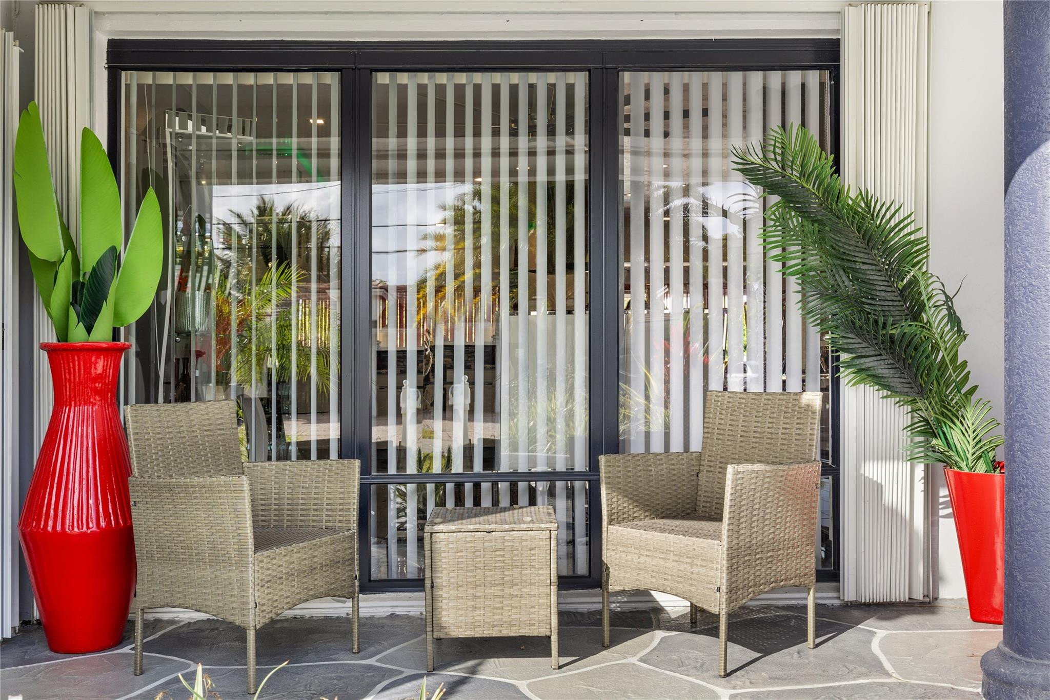 2531 Northeast 47th Street Lighthouse Point, FL 33064 - Photo 26 of 52 a view of balcony with two chairs and a potted plant