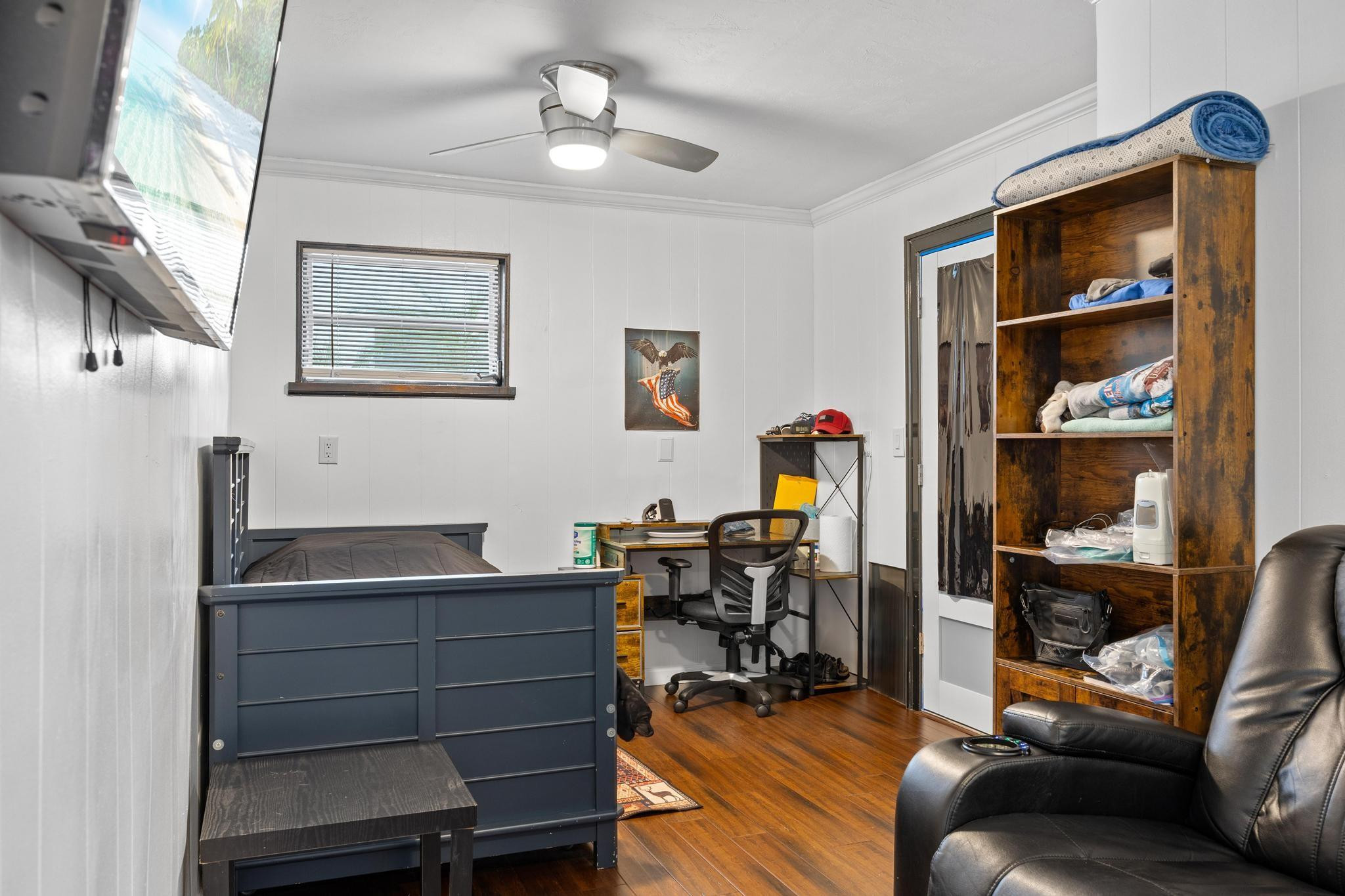 2531 Northeast 47th Street Lighthouse Point, FL 33064 - Photo 40 of 52 a view of a workspace with furniture and wooden floor