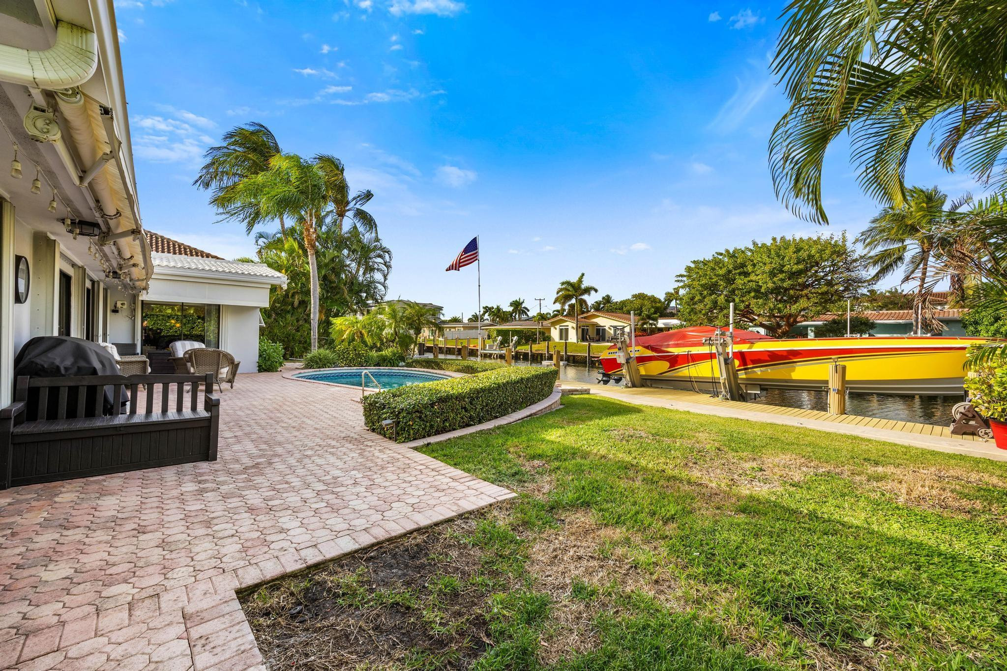 2531 Northeast 47th Street Lighthouse Point, FL 33064 - Photo 41 of 52 a view of a house with a yard