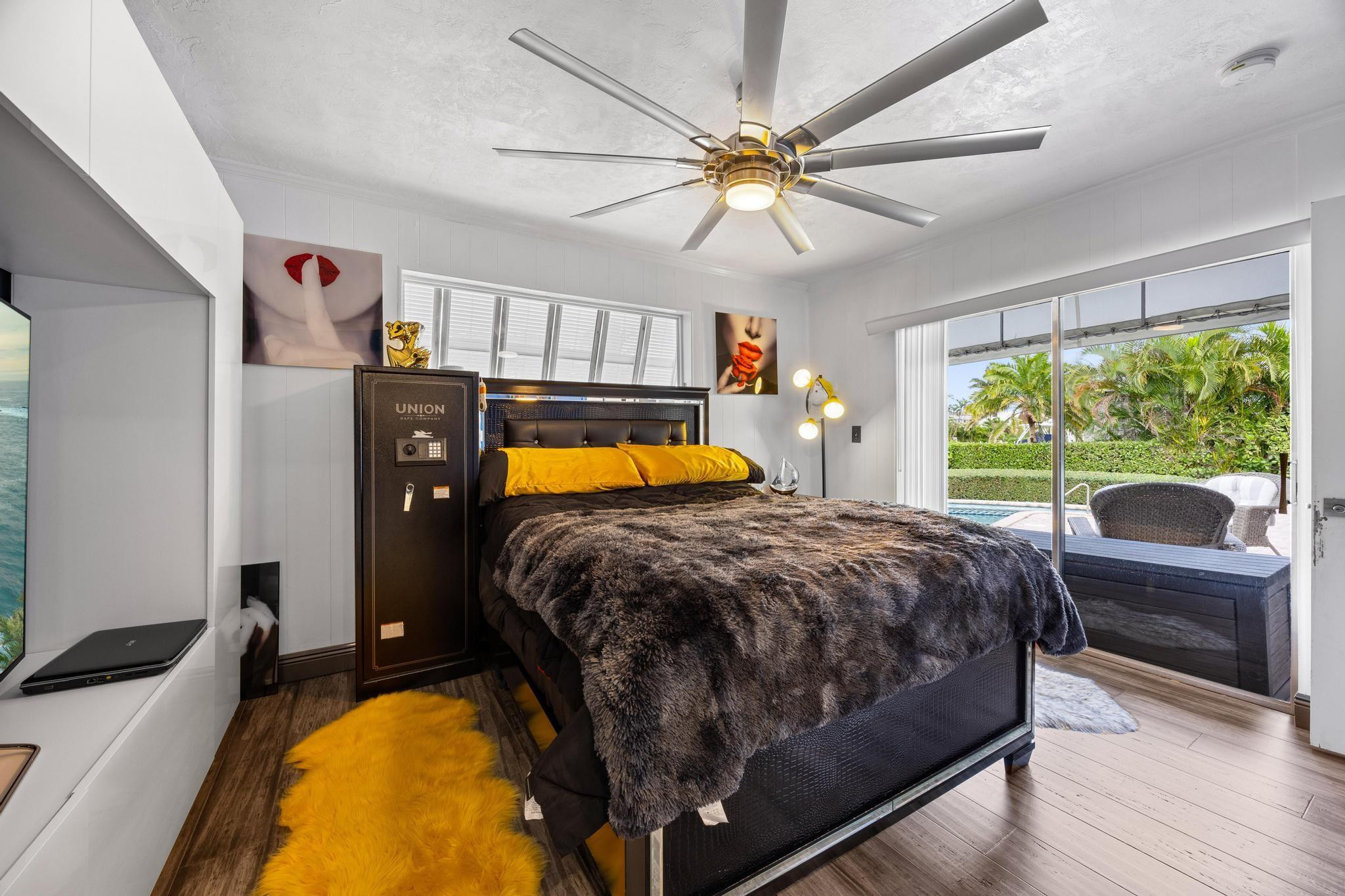 2531 Northeast 47th Street Lighthouse Point, FL 33064 - Photo 42 of 52 a bed room with a bed and a television