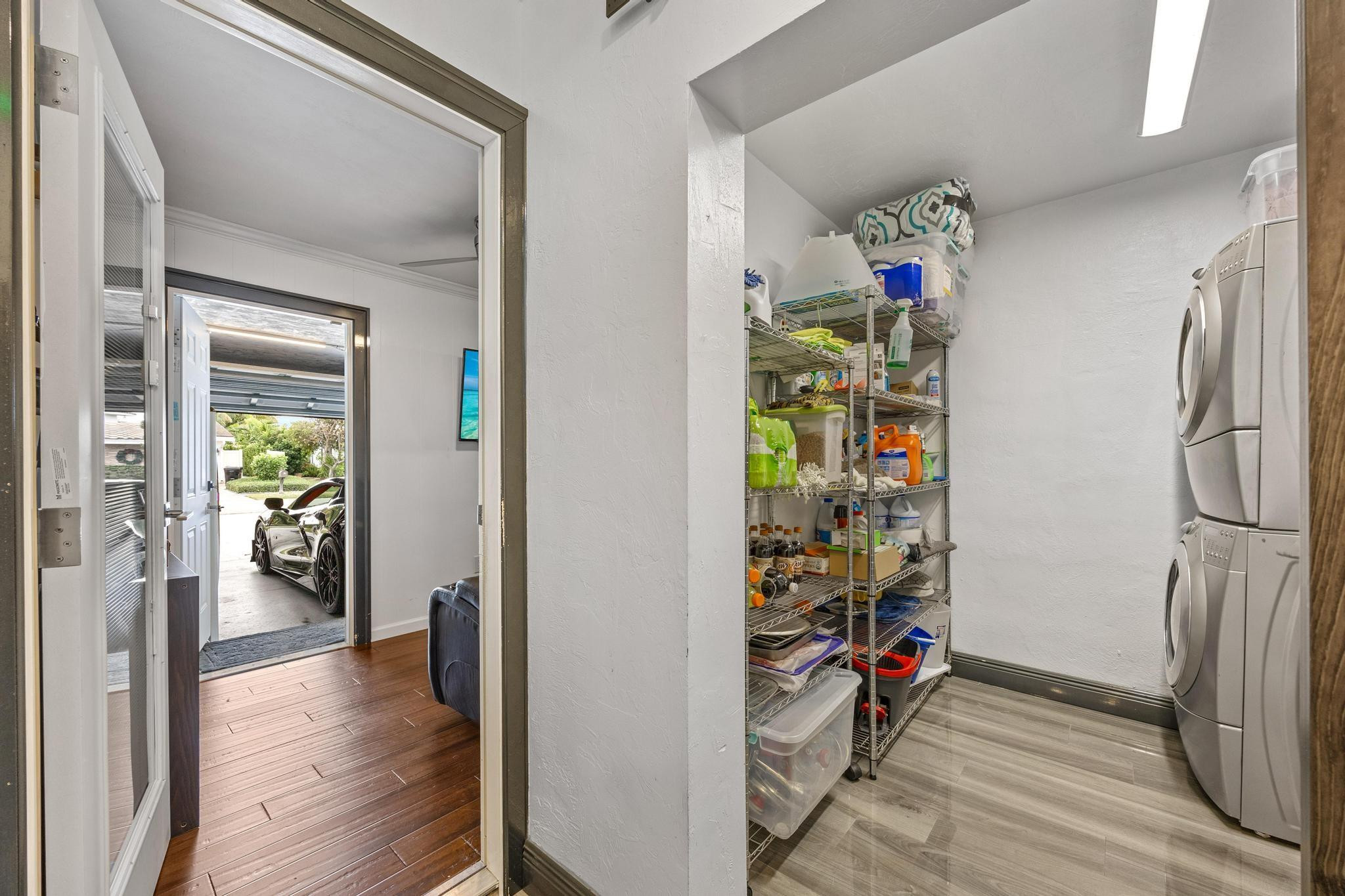 2531 Northeast 47th Street Lighthouse Point, FL 33064 - Photo 43 of 52 a view of a hallway with wooden floor and a workspace