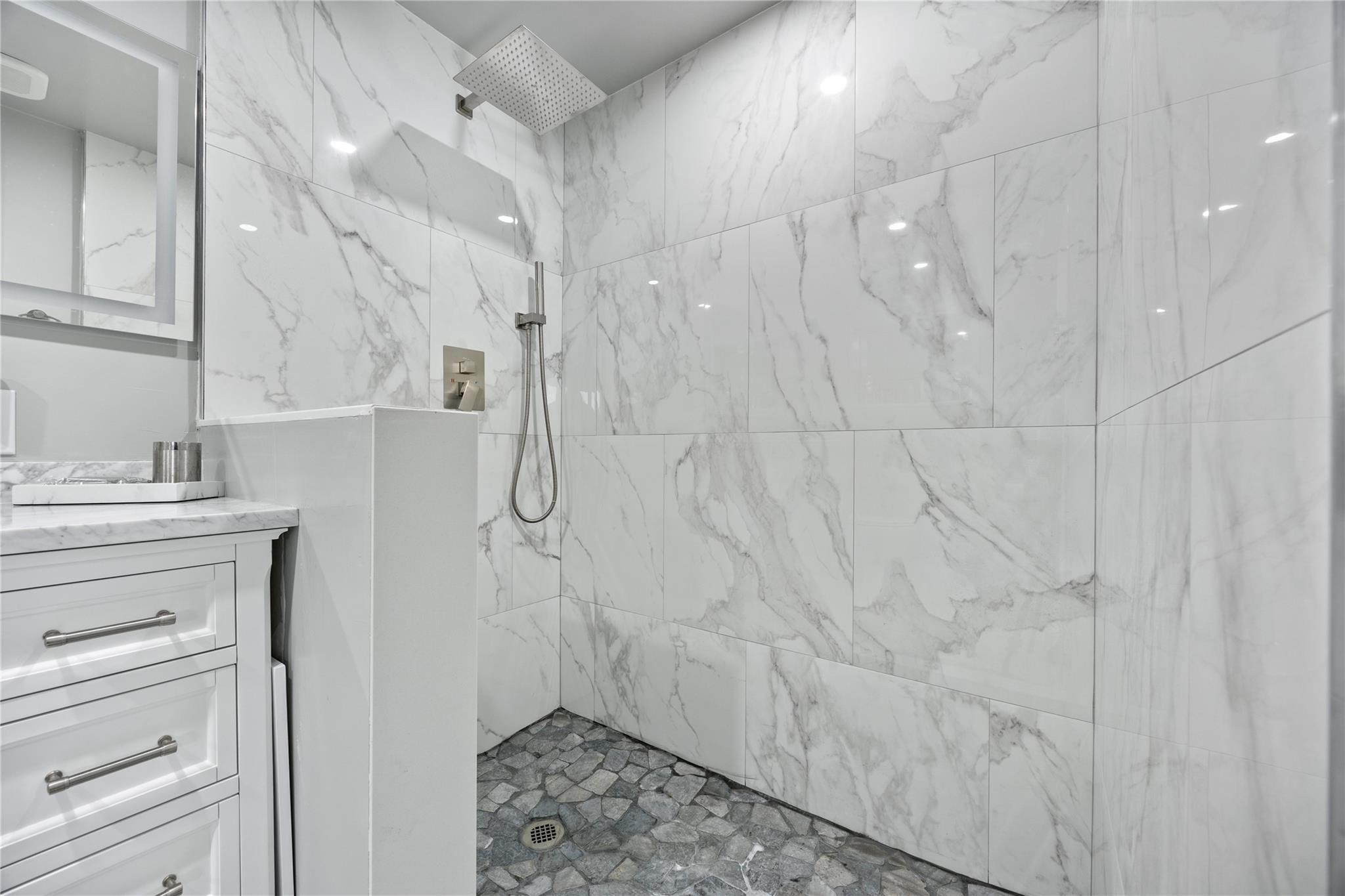 2531 Northeast 47th Street Lighthouse Point, FL 33064 - Photo 46 of 52 a bathroom with a sink a toilet and shower