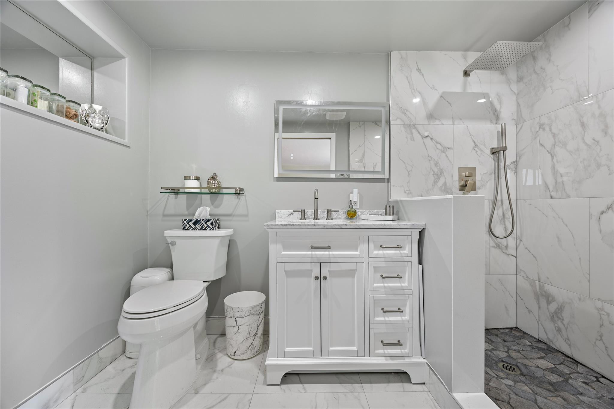2531 Northeast 47th Street Lighthouse Point, FL 33064 - Photo 47 of 52 a bathroom with a toilet sink vanity granite and shower