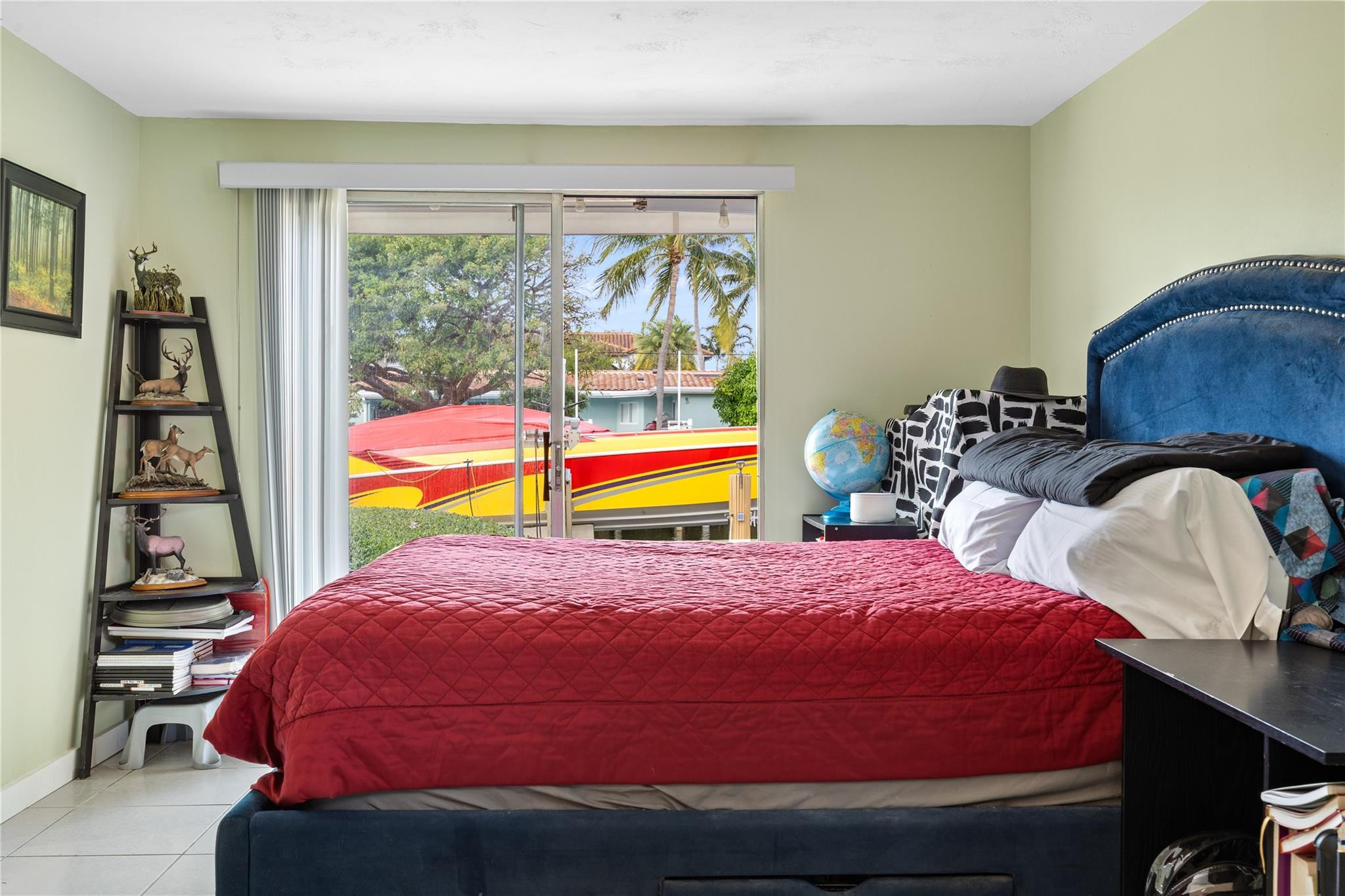 2531 Northeast 47th Street Lighthouse Point, FL 33064 - Photo 48 of 52 a bedroom with a bed and window