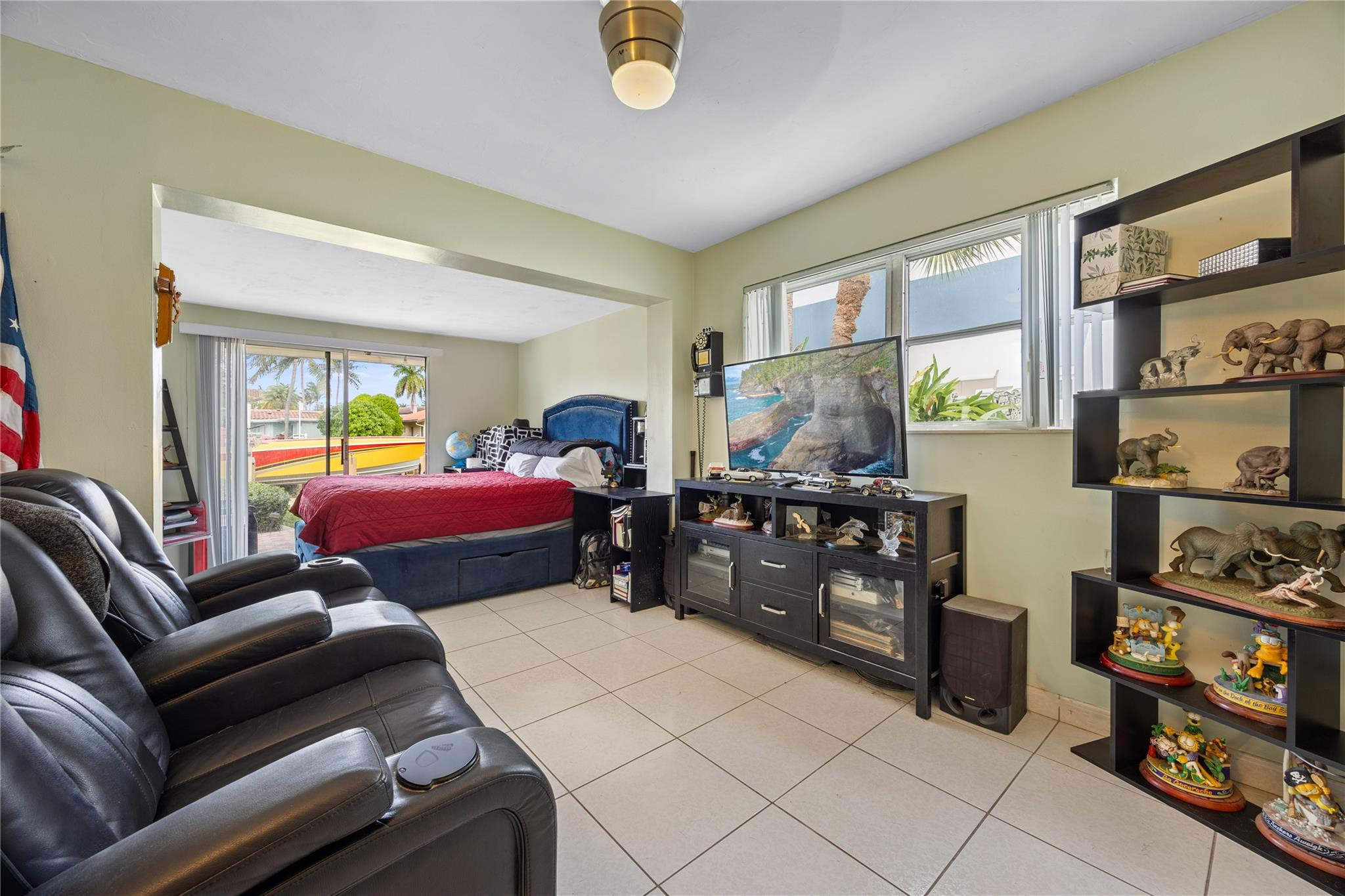 2531 Northeast 47th Street Lighthouse Point, FL 33064 - Photo 49 of 52 a bedroom with furniture and a window