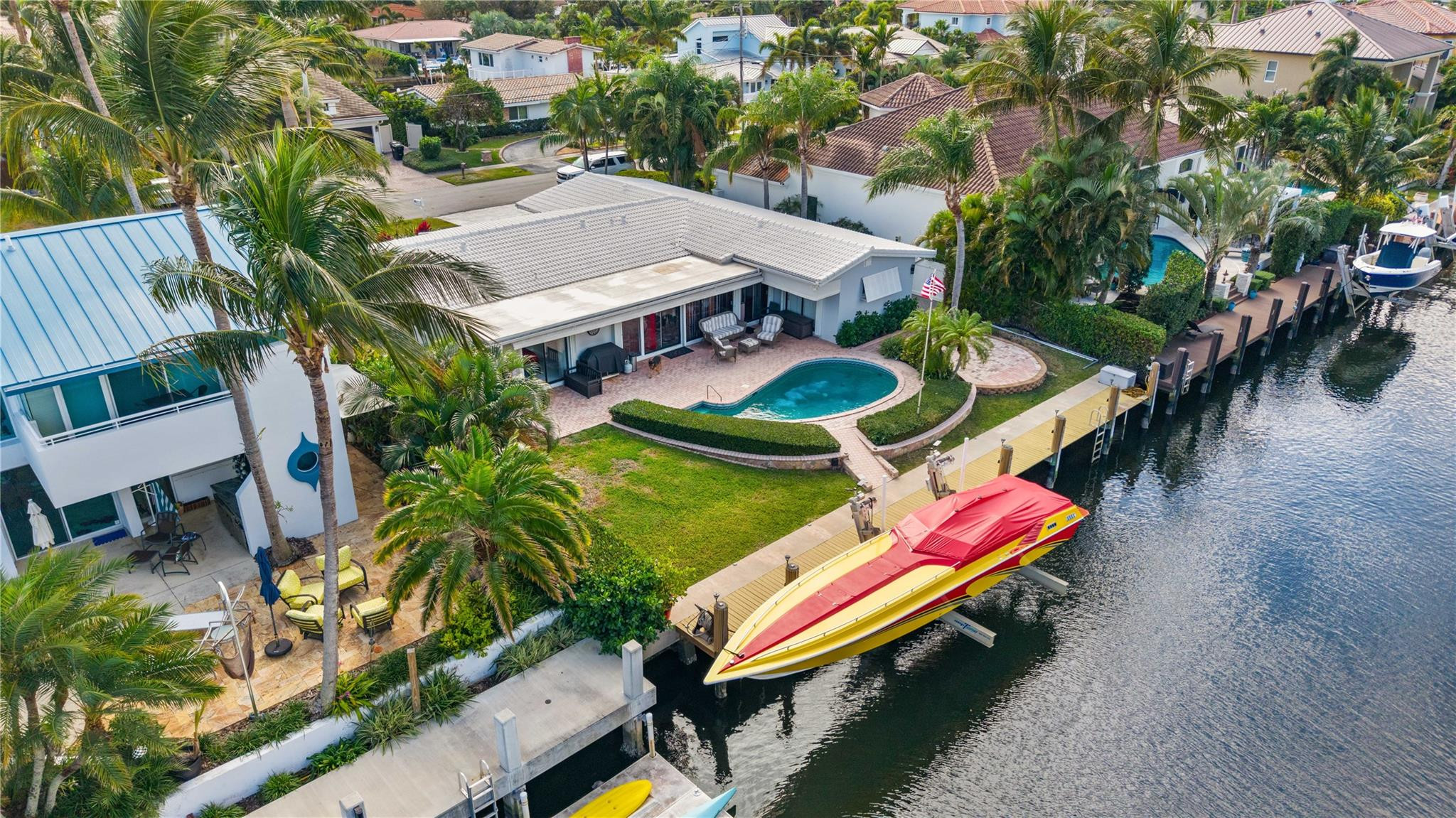 2531 Northeast 47th Street Lighthouse Point, FL 33064 - Photo 5 of 52 an aerial view of a house with swimming pool patio and outdoor seating