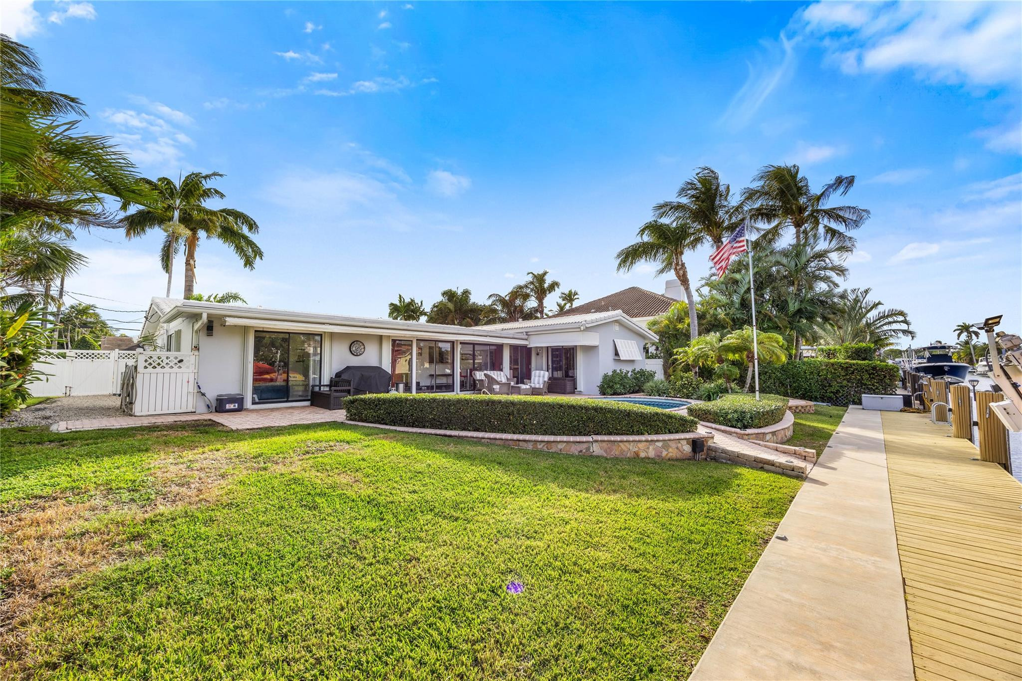 2531 Northeast 47th Street Lighthouse Point, FL 33064 - Photo 52 of 52 a view of a house with a swimming pool