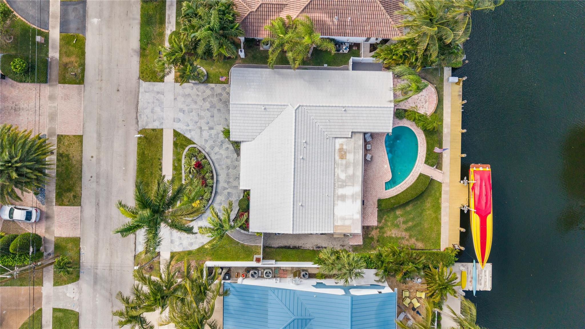 2531 Northeast 47th Street Lighthouse Point, FL 33064 - Photo 6 of 52 an aerial view of a house with a yard and potted plants