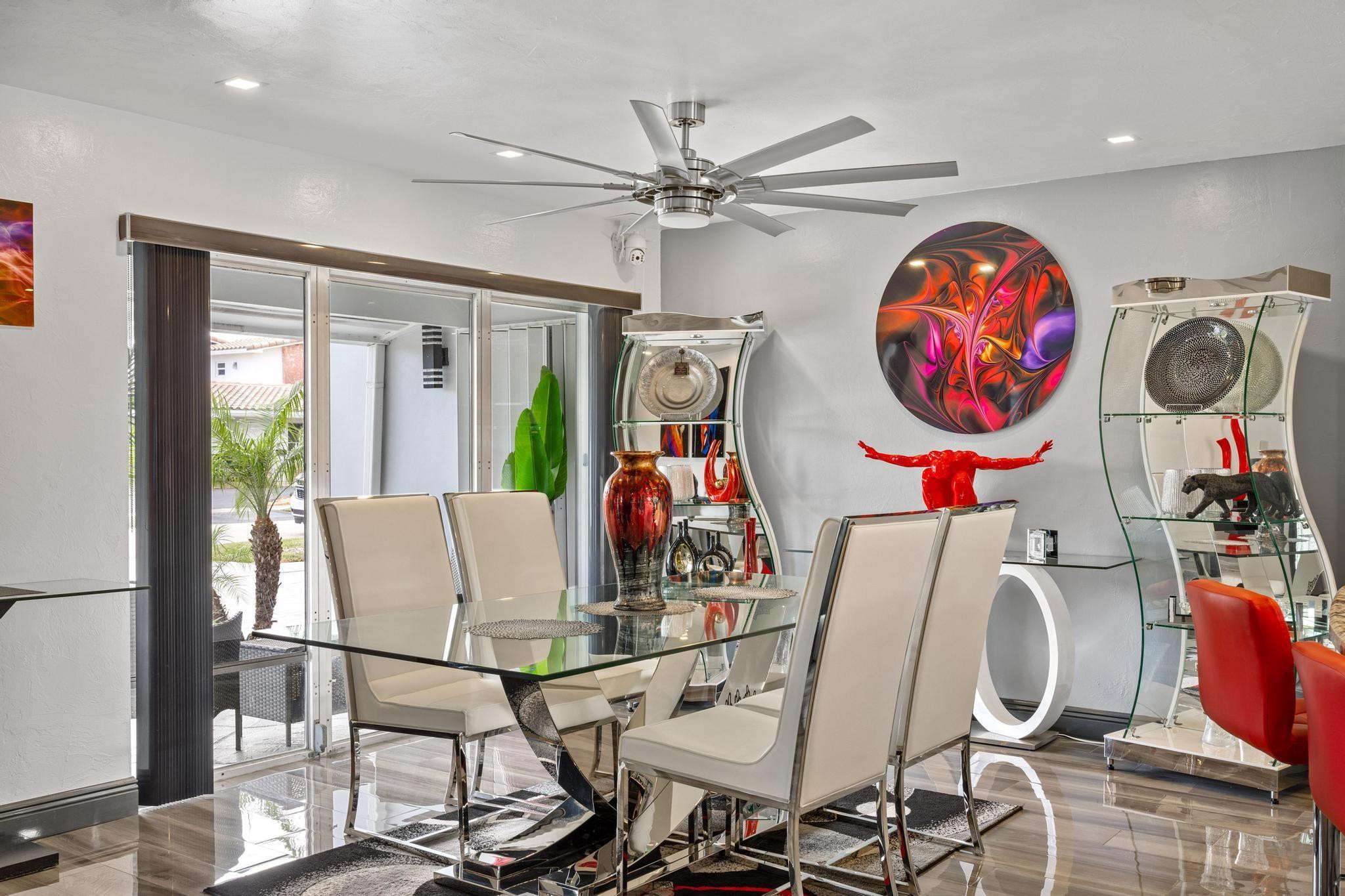 2531 Northeast 47th Street Lighthouse Point, FL 33064 - Photo 10 of 52 a living room with furniture and a chandelier