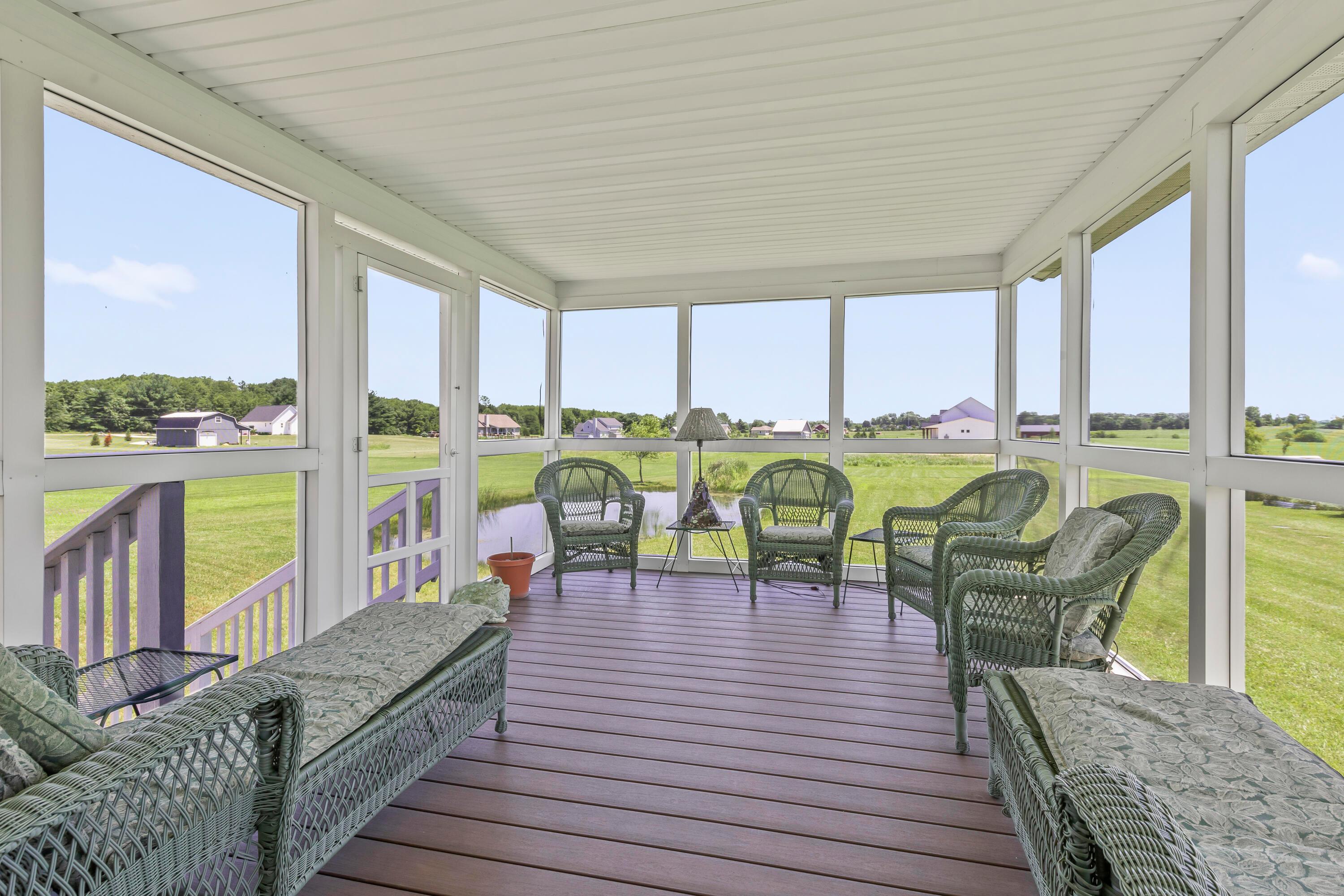 3582 Panhandle Road Delaware, OH 43015 - Photo 31 of 65 • Composite deck • Screened walls • Steps down to patio