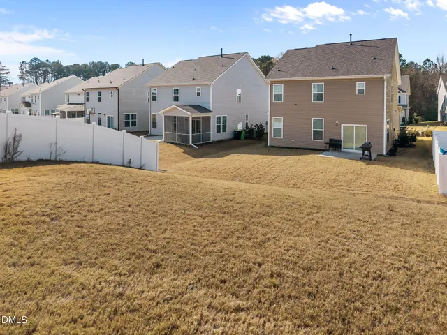 an aerial view of a house with swimming pool
