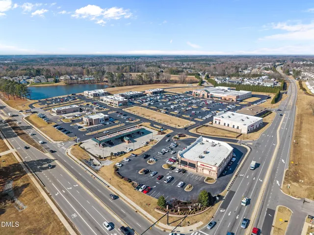 an aerial view of a house with a lake view