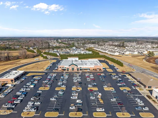 an aerial view of a house with a lake view