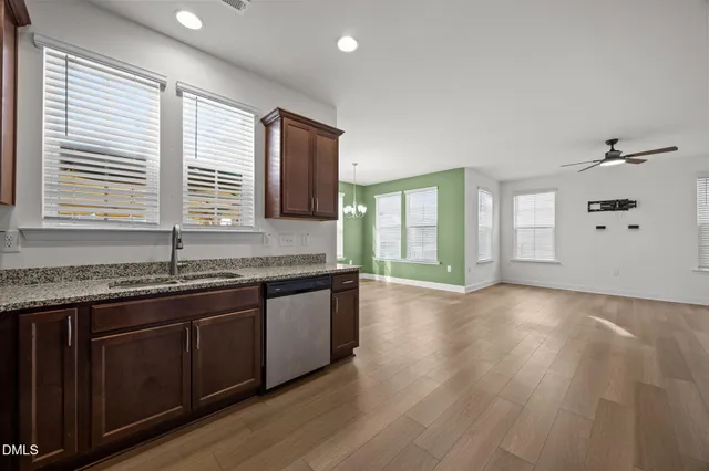 a view of a kitchen counter space and windows