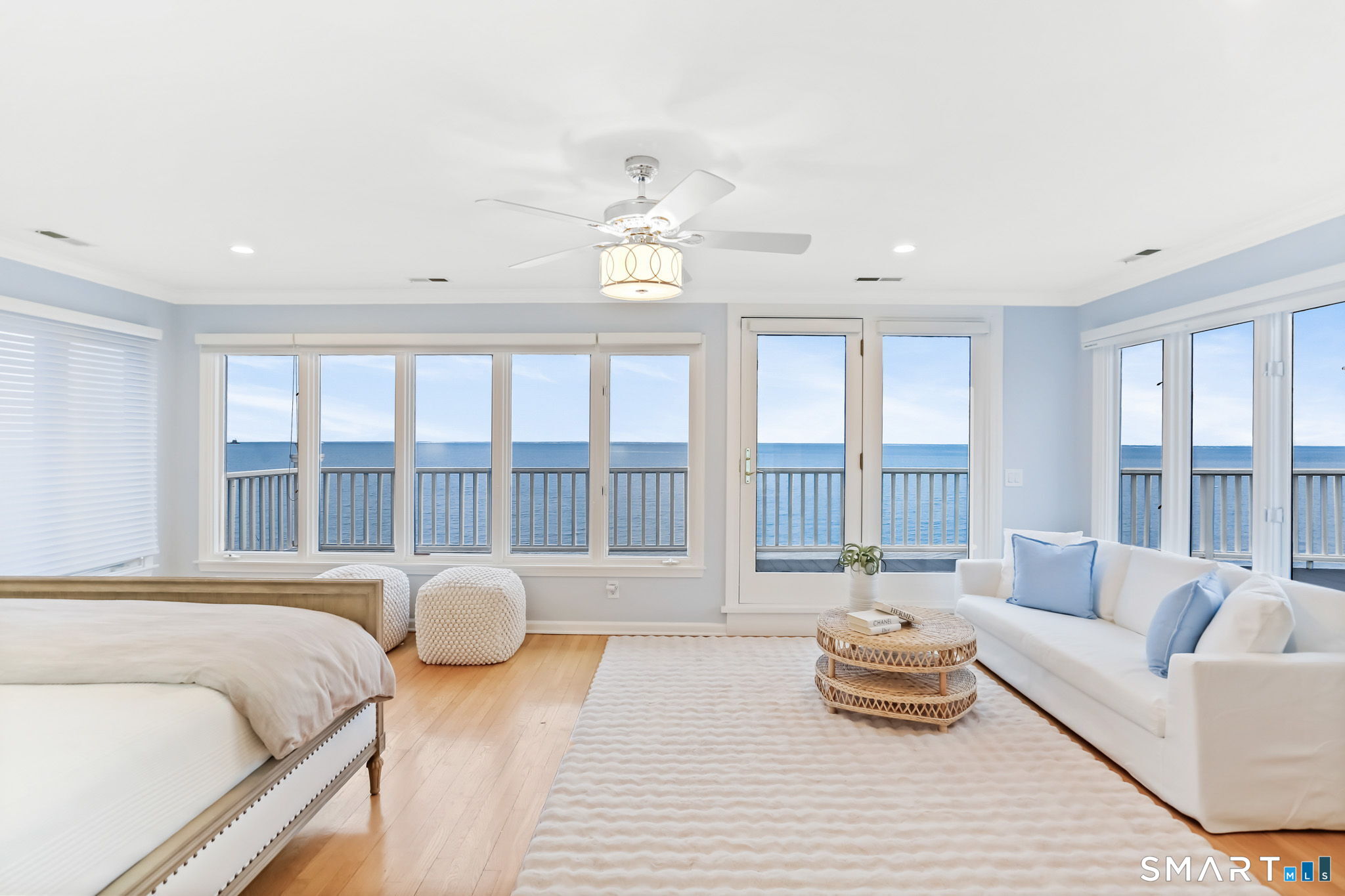 1149 Fairfield Beach Road Fairfield, CT 06824 - Photo 21 of 40 a spacious bedroom with a bed couch and a large window